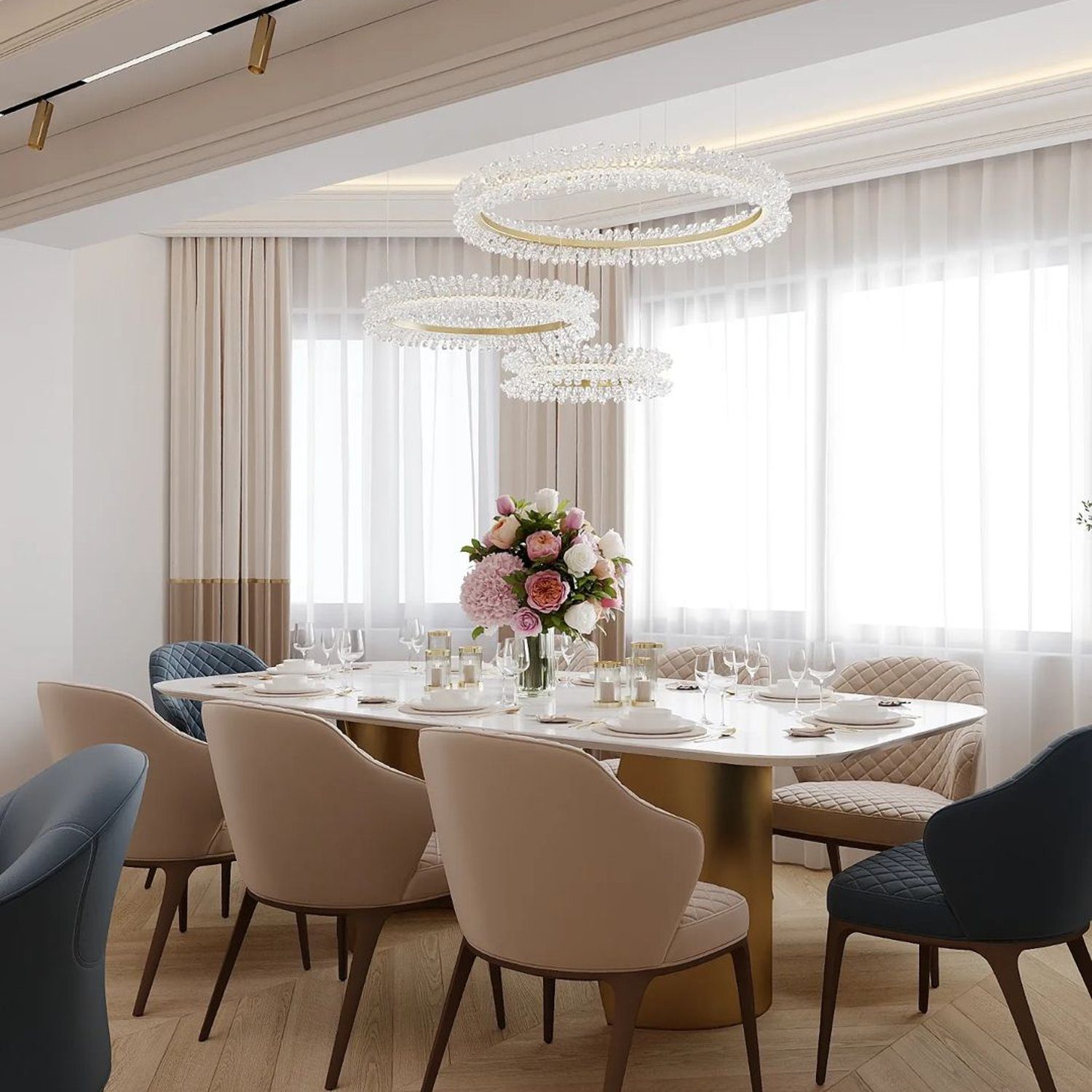 Elegantly set dining table with hanging crystal chandeliers in a modern room