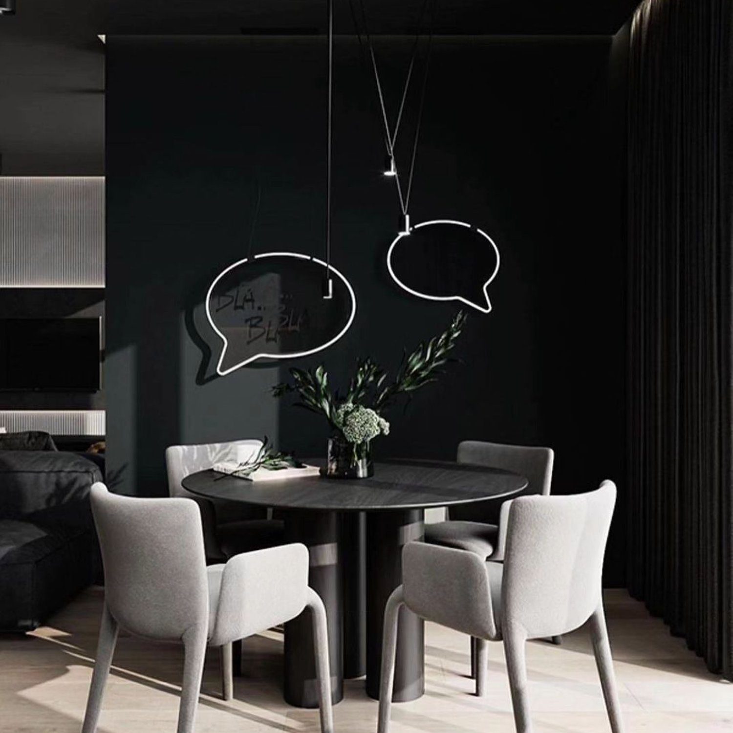 Contemporary dining area with speech bubble lights