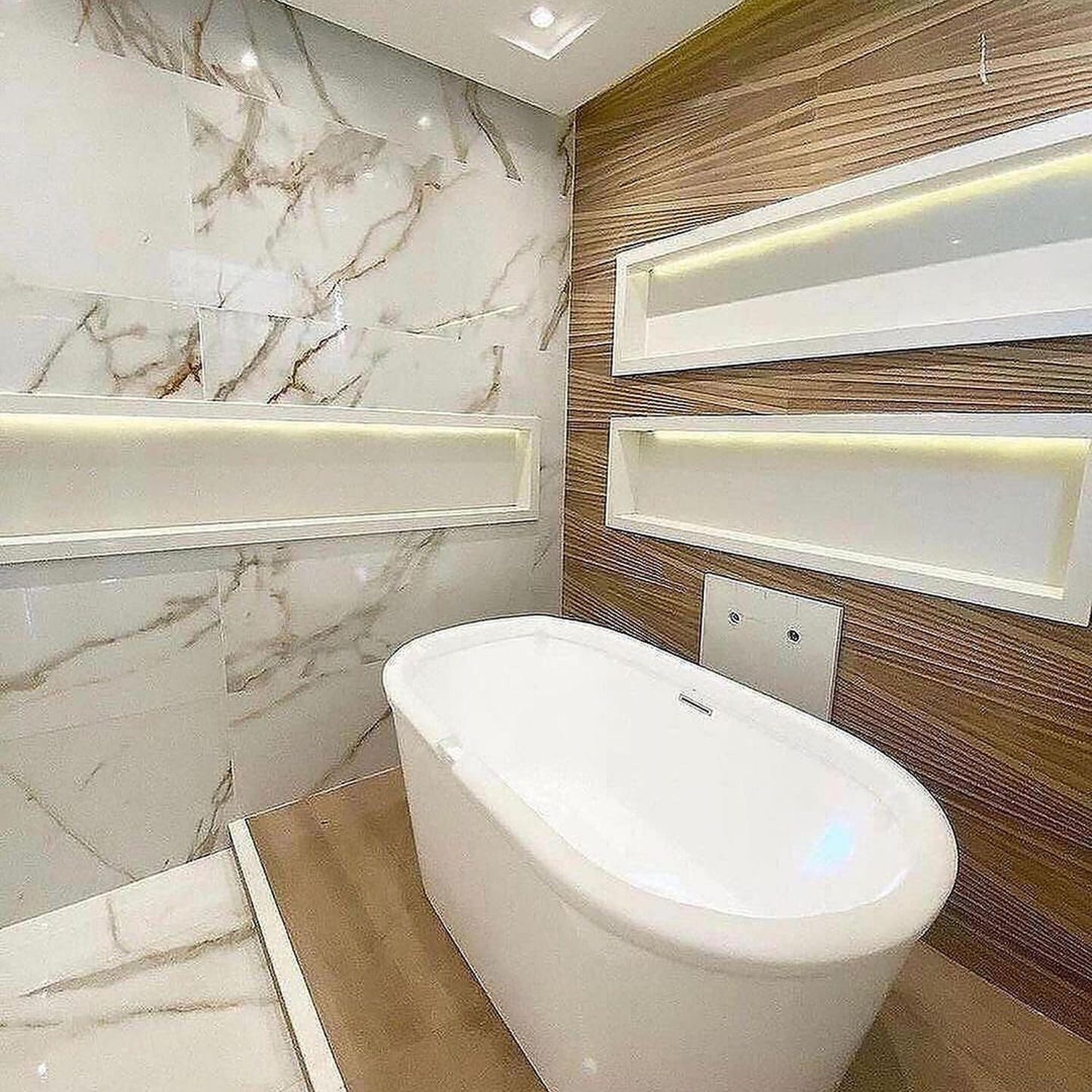 A modern and elegant bathroom featuring marble walls