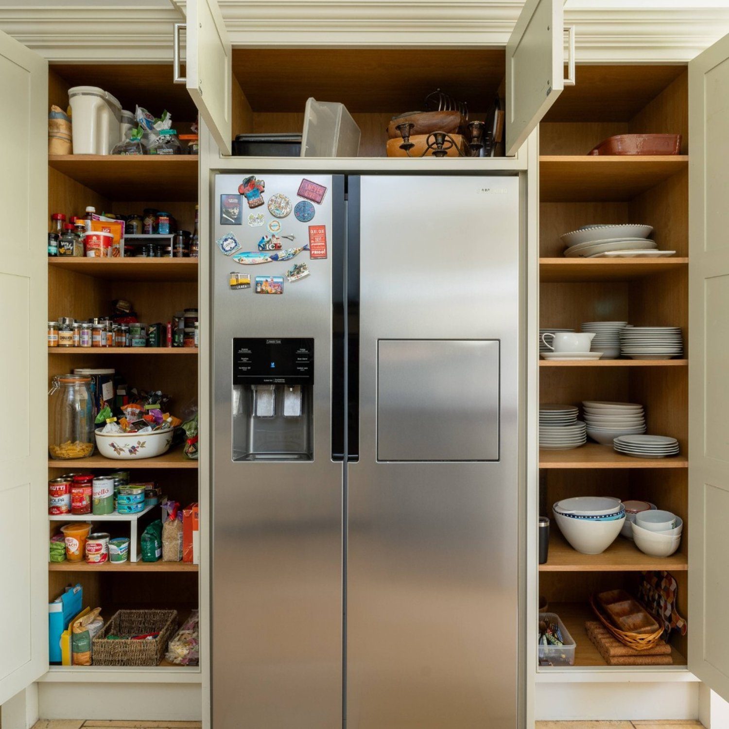 Stylish pantry organization with a modern refrigerator