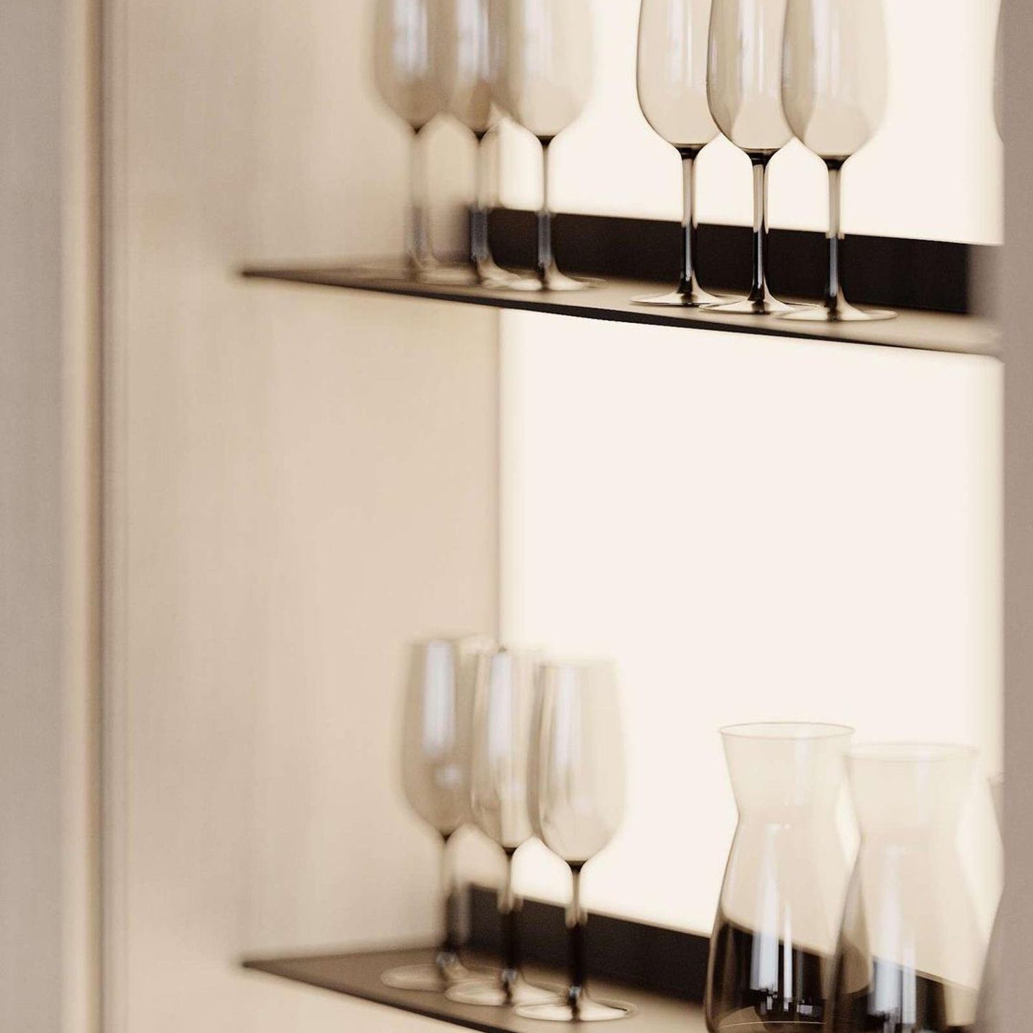 Elegantly arranged glassware on floating shelves