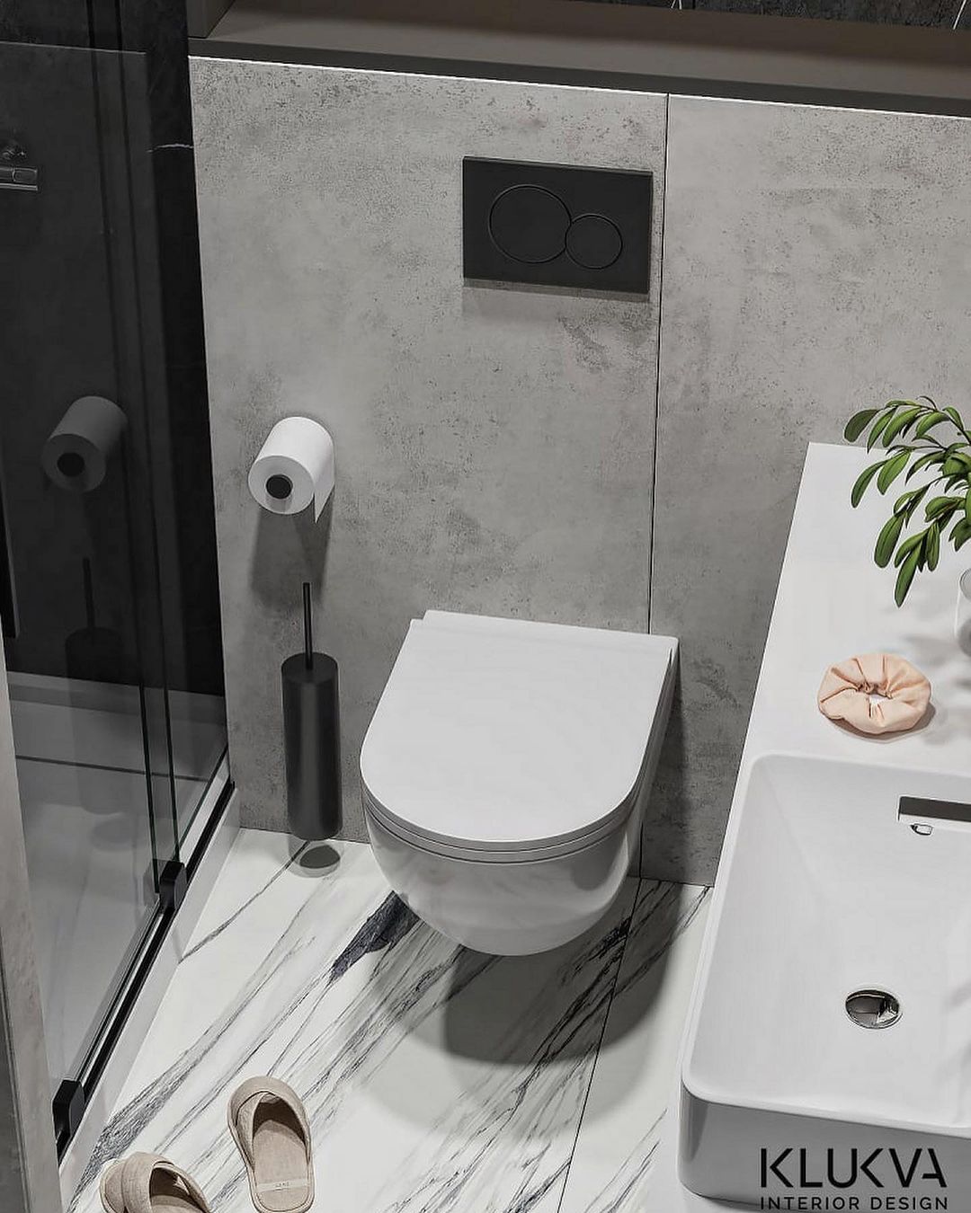 A chic and modern bathroom featuring gray-scale tiles, minimalist floating toilet, and a sleek stone sink.