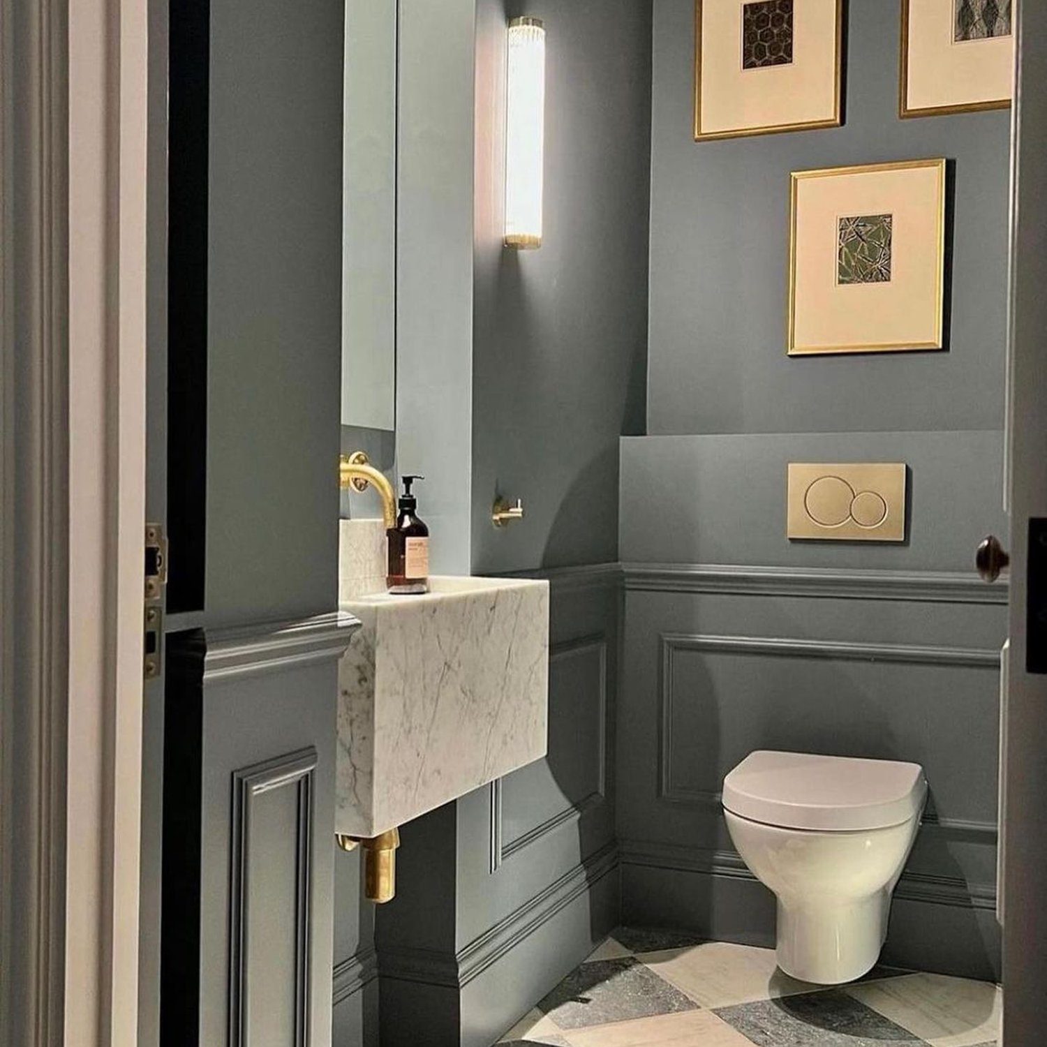 A chic and modern bathroom with sophisticated grey paneling