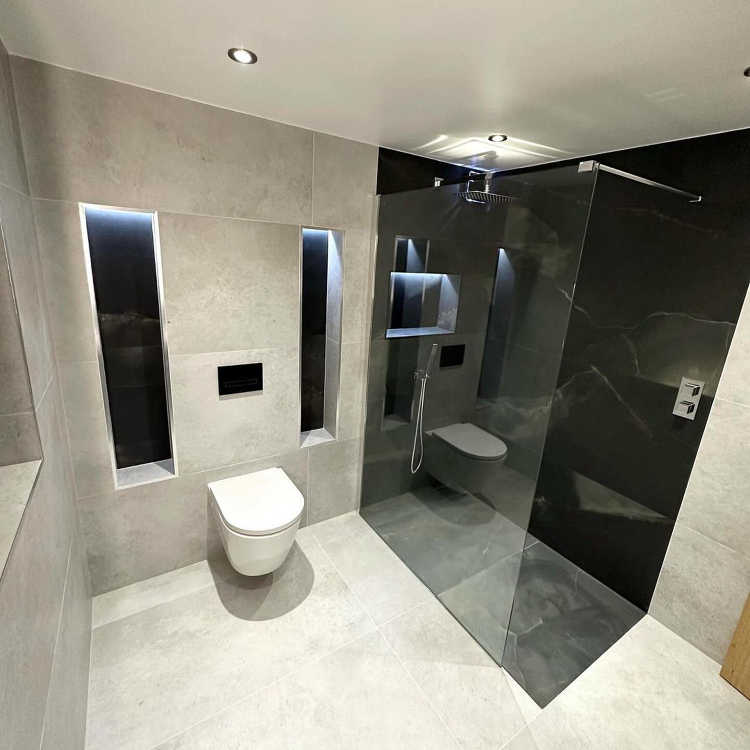 A sleek and modern bathroom featuring contrasting textures and clean lines