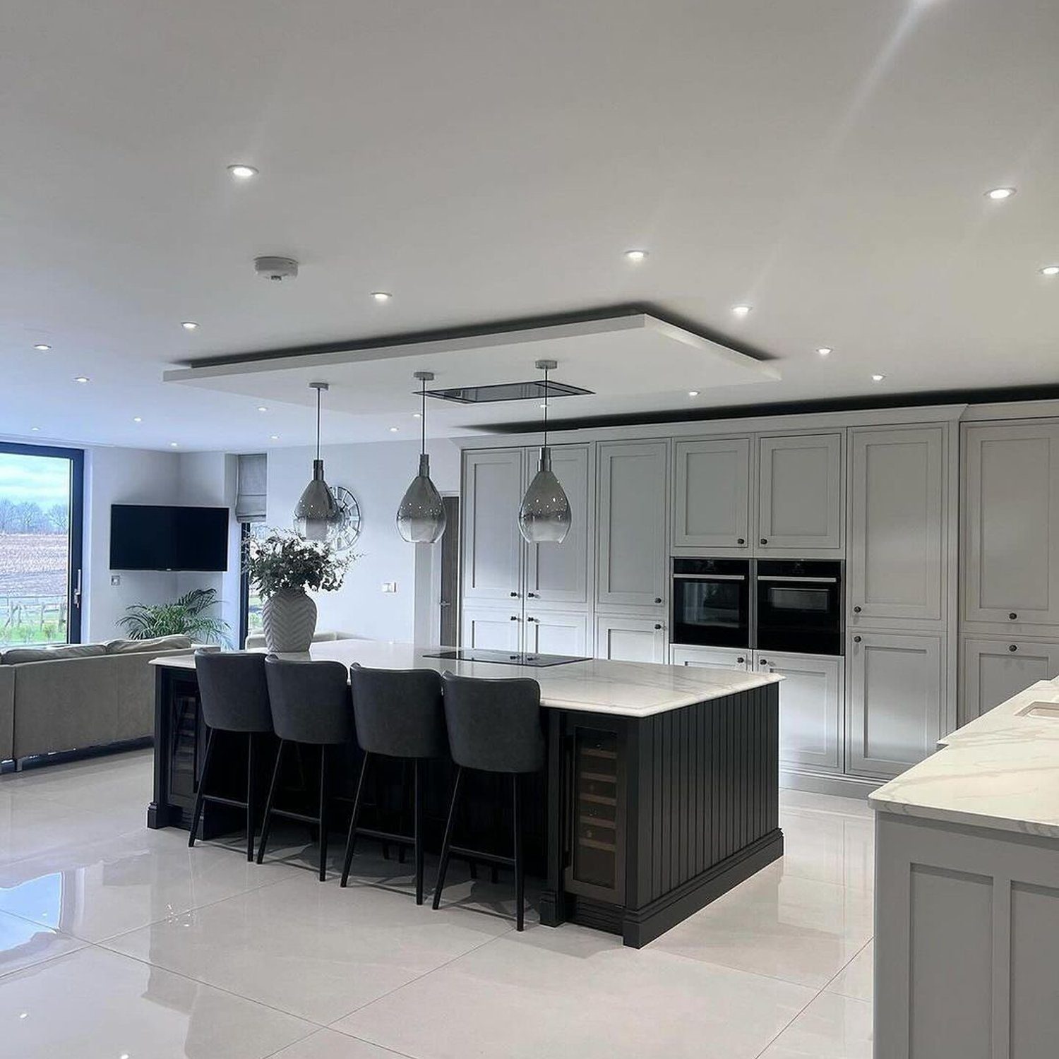 Elegant and modern kitchen with cohesive grey tones and smart lighting