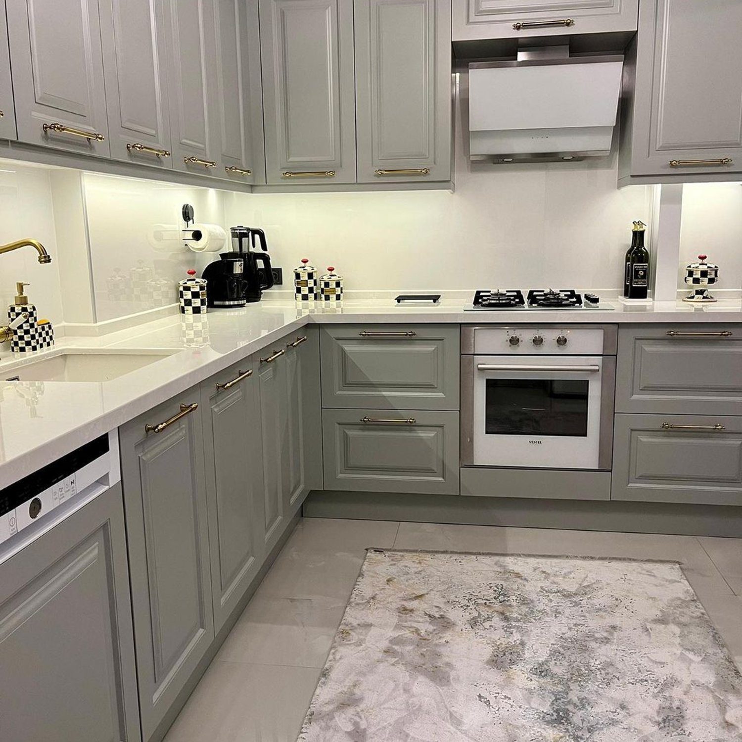 Elegant modern kitchen with grey cabinetry and gold accents