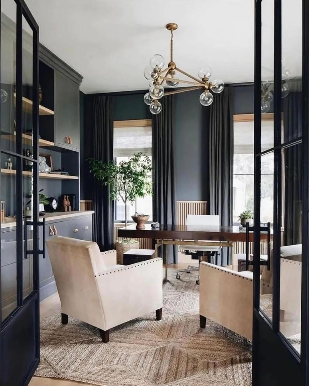 A sophisticated home office with dark-themed decor