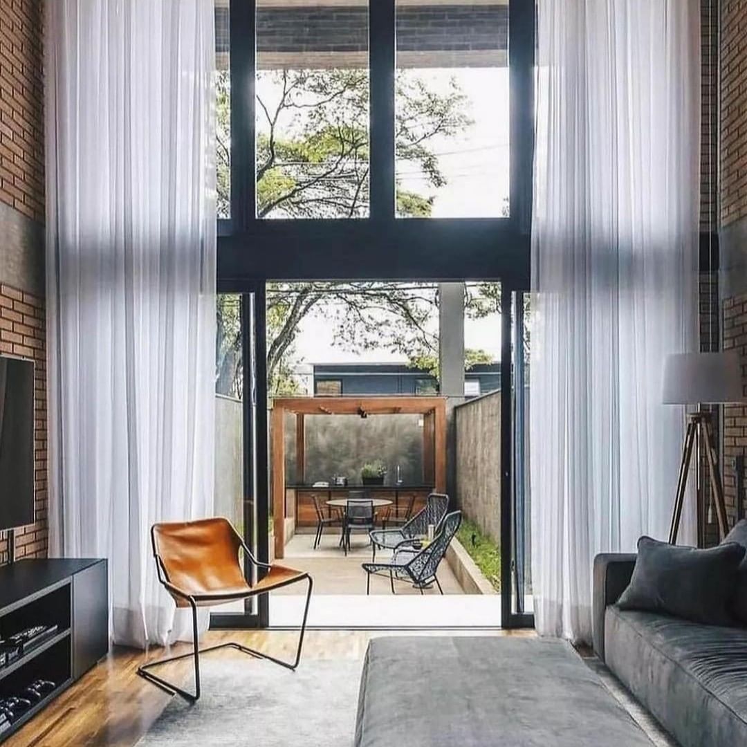 A modern living room seamlessly blending with an outdoor patio space