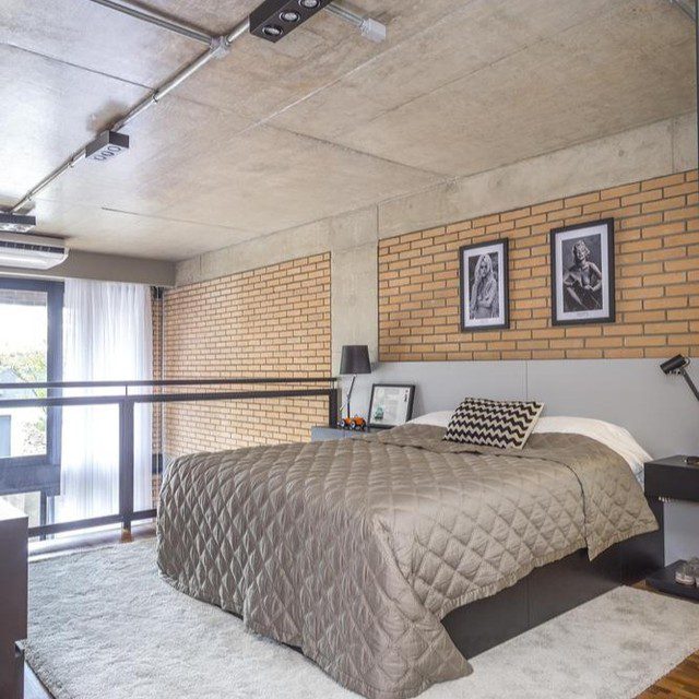 Modern Industrial Style Bedroom with Exposed Concrete and Brick