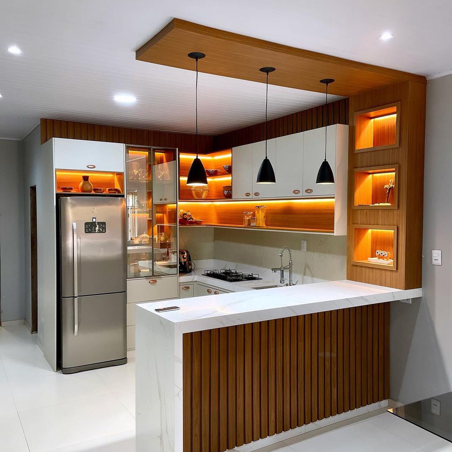 A modern kitchen with wooden accents and sleek appliances