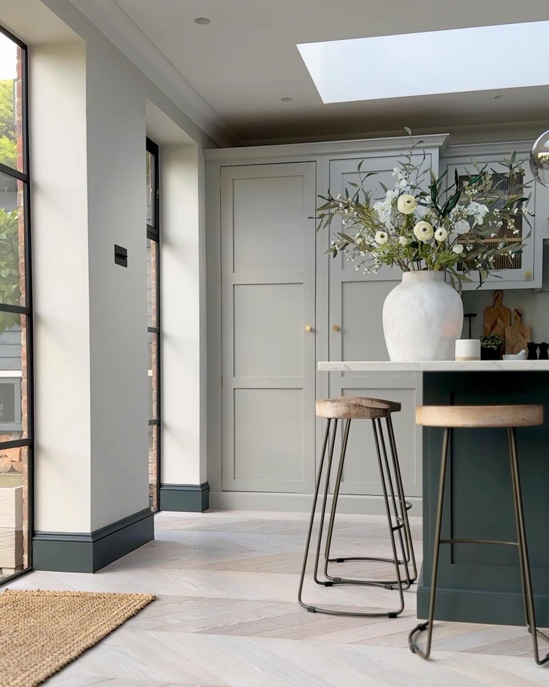 A modern kitchen with natural light and chic, minimalist decor