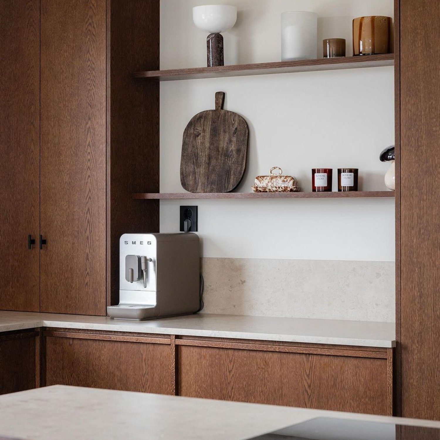 A modern kitchen corner featuring sleek wooden cabinetry