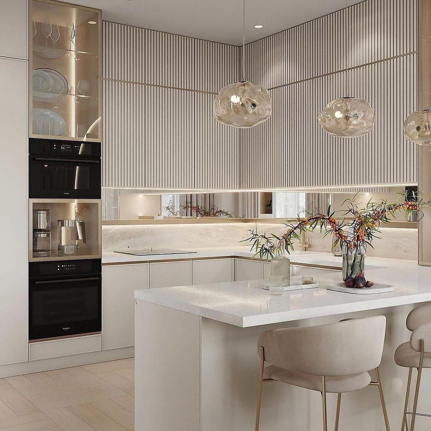 Sleek modern kitchen design featuring reflective vertical lines, elegant pendant lighting, and a minimalist island.