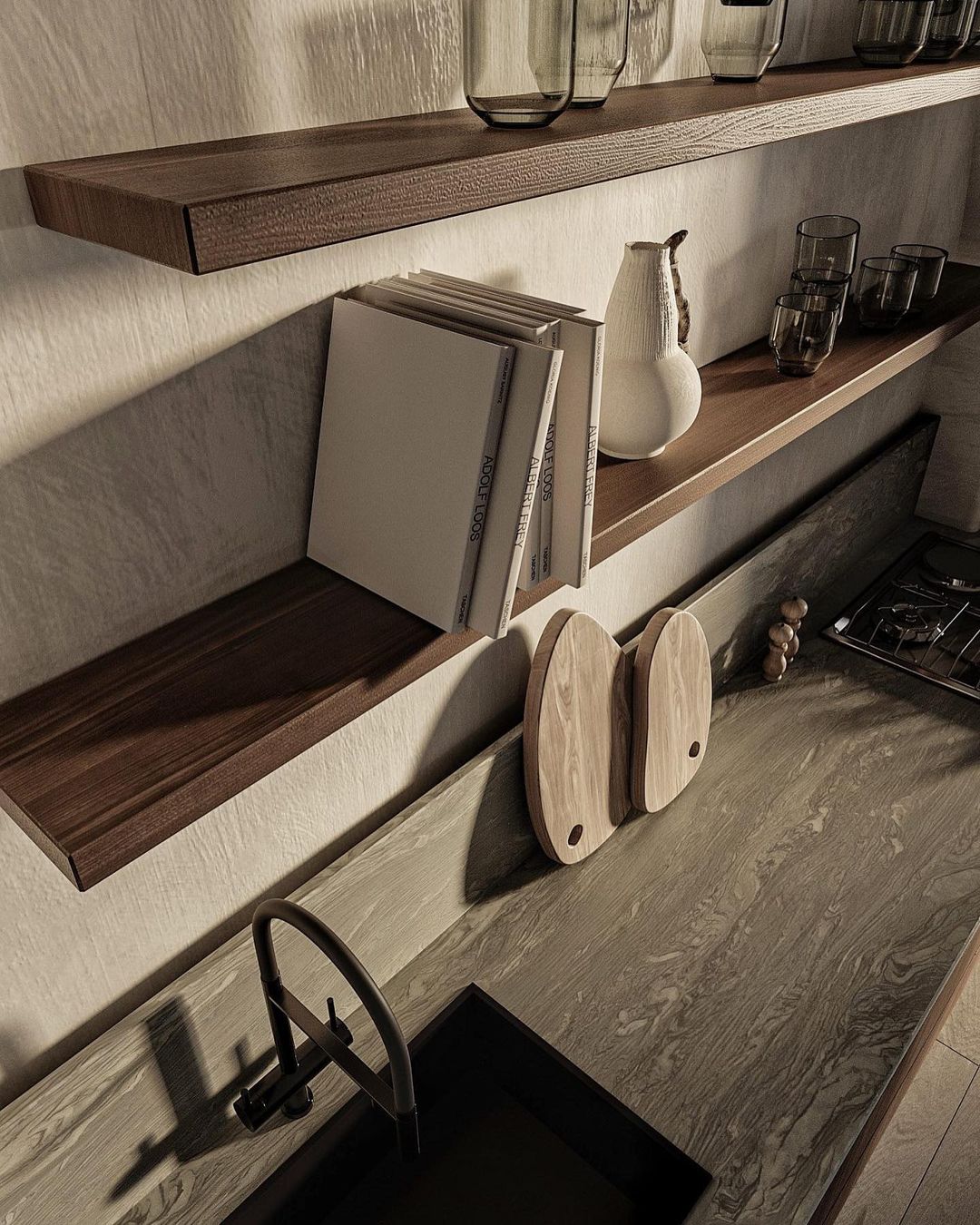 Contemporary kitchen shelves with decorative items and a sleek dark faucet