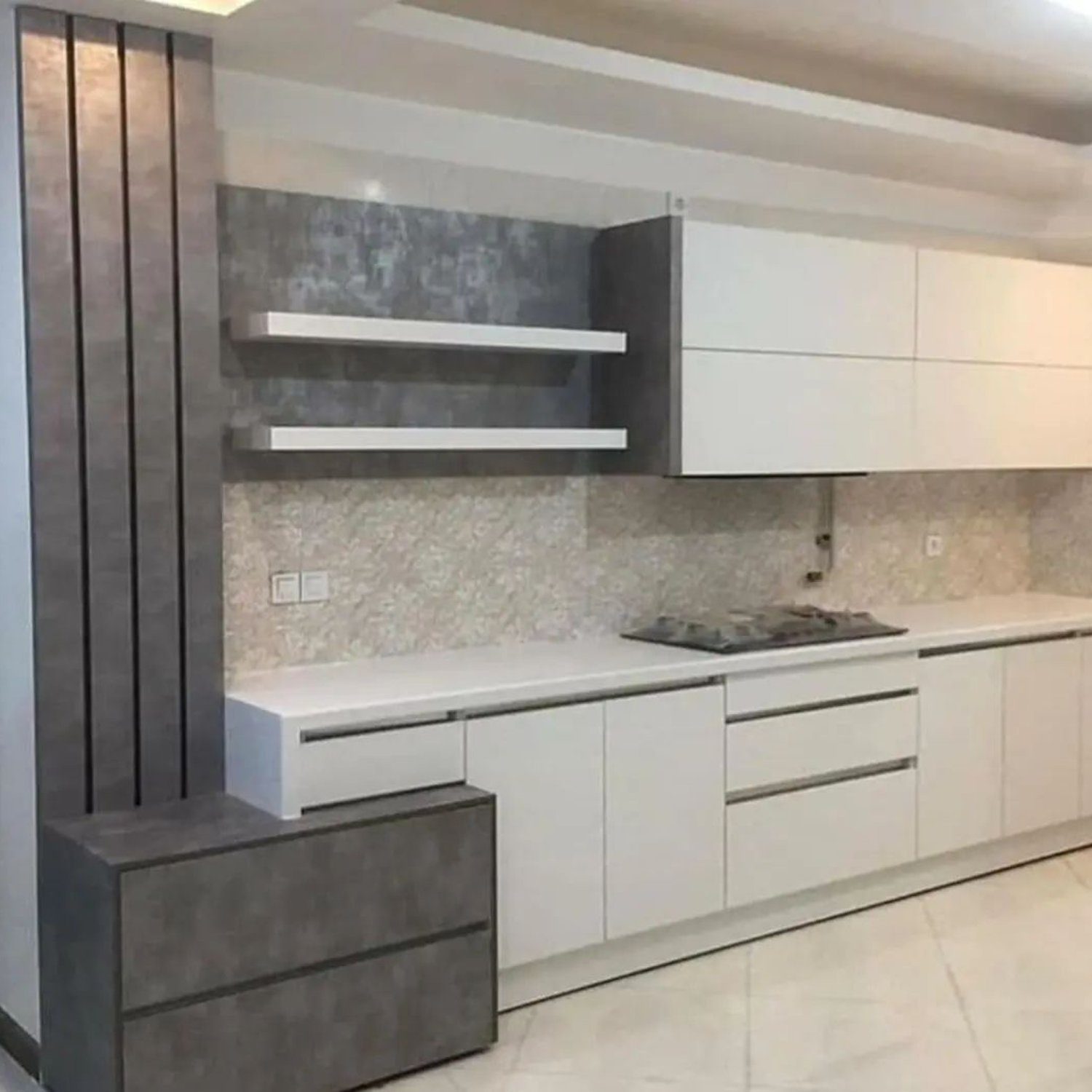 A sleek and modern kitchen design featuring white cabinetry and grey accents