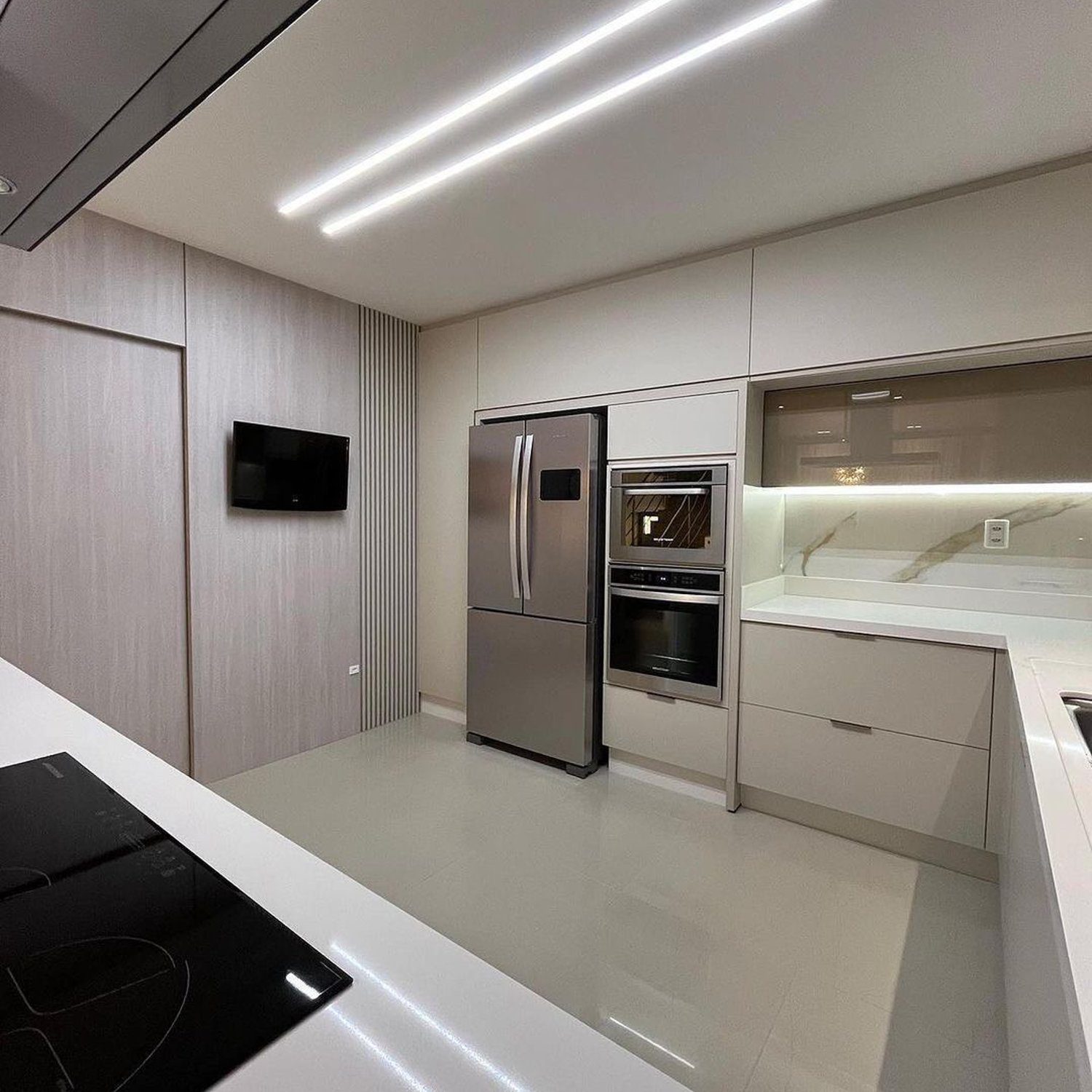 A sleek and modern kitchen, featuring high-tech appliances and minimalist design