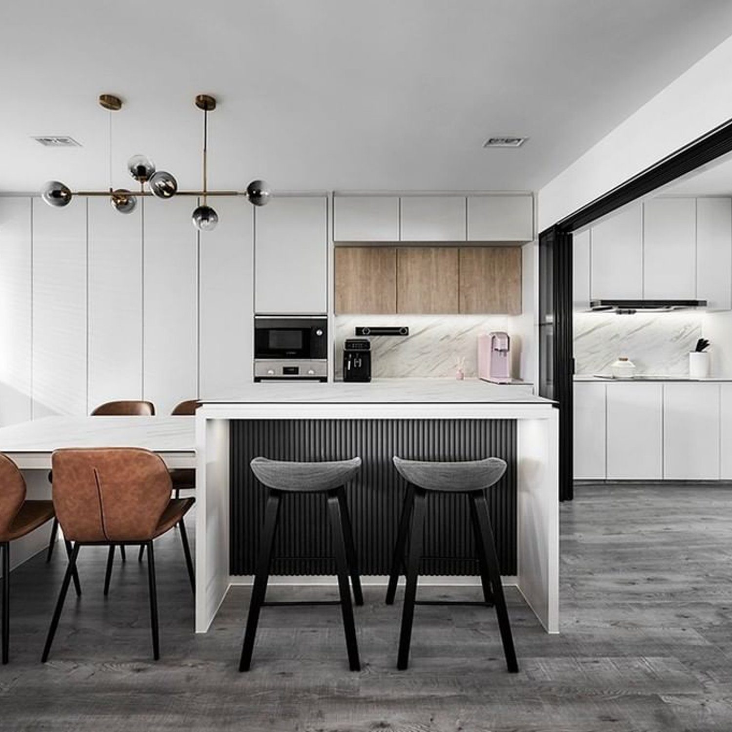 A sleek and modern kitchen featuring a monochromatic color scheme