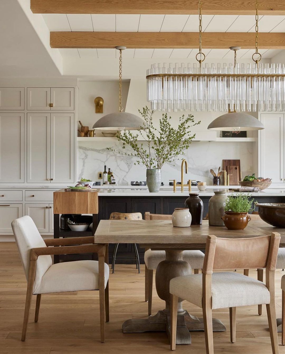 A modern kitchen with warm wood accents and brass fixtures