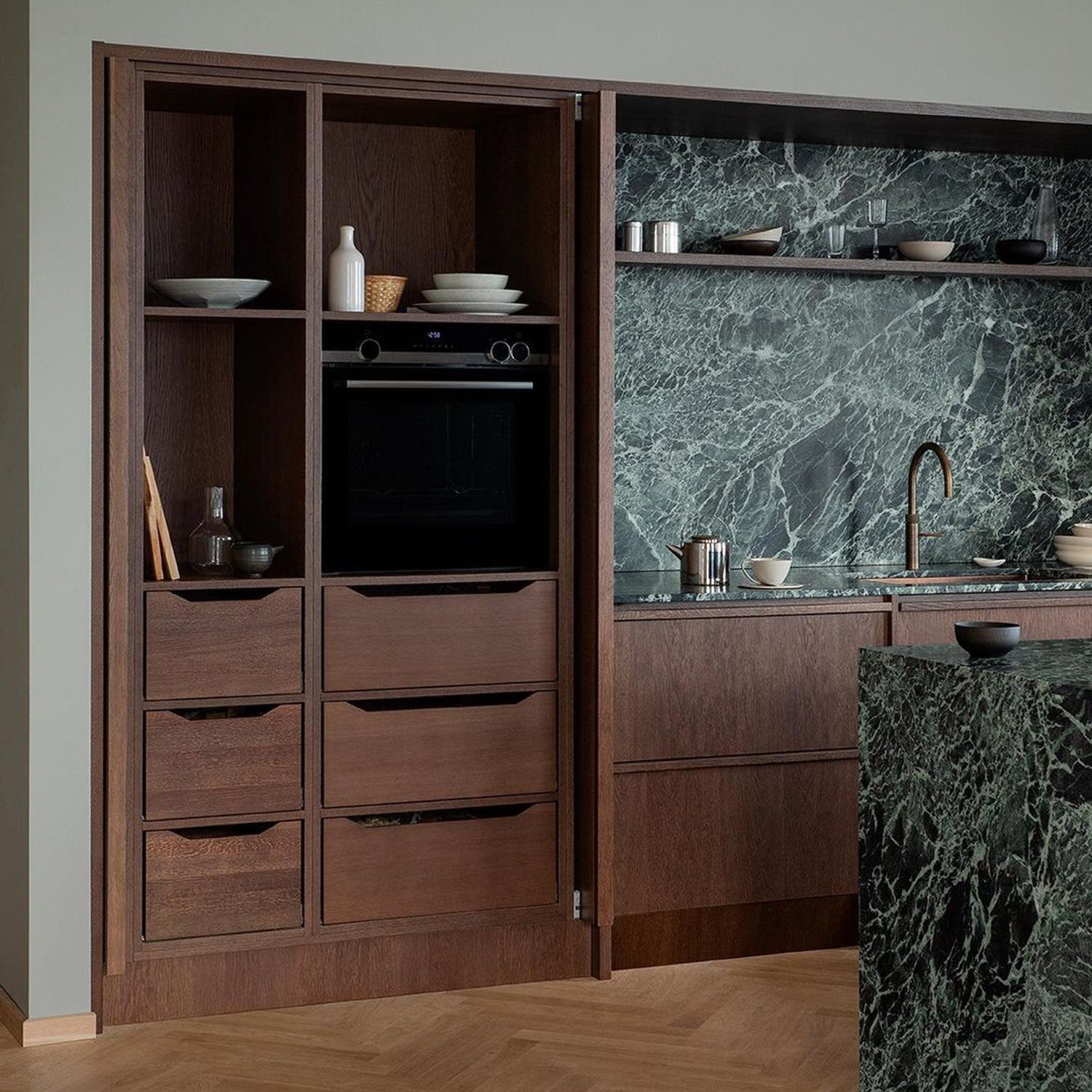 A modern kitchen with marble accents