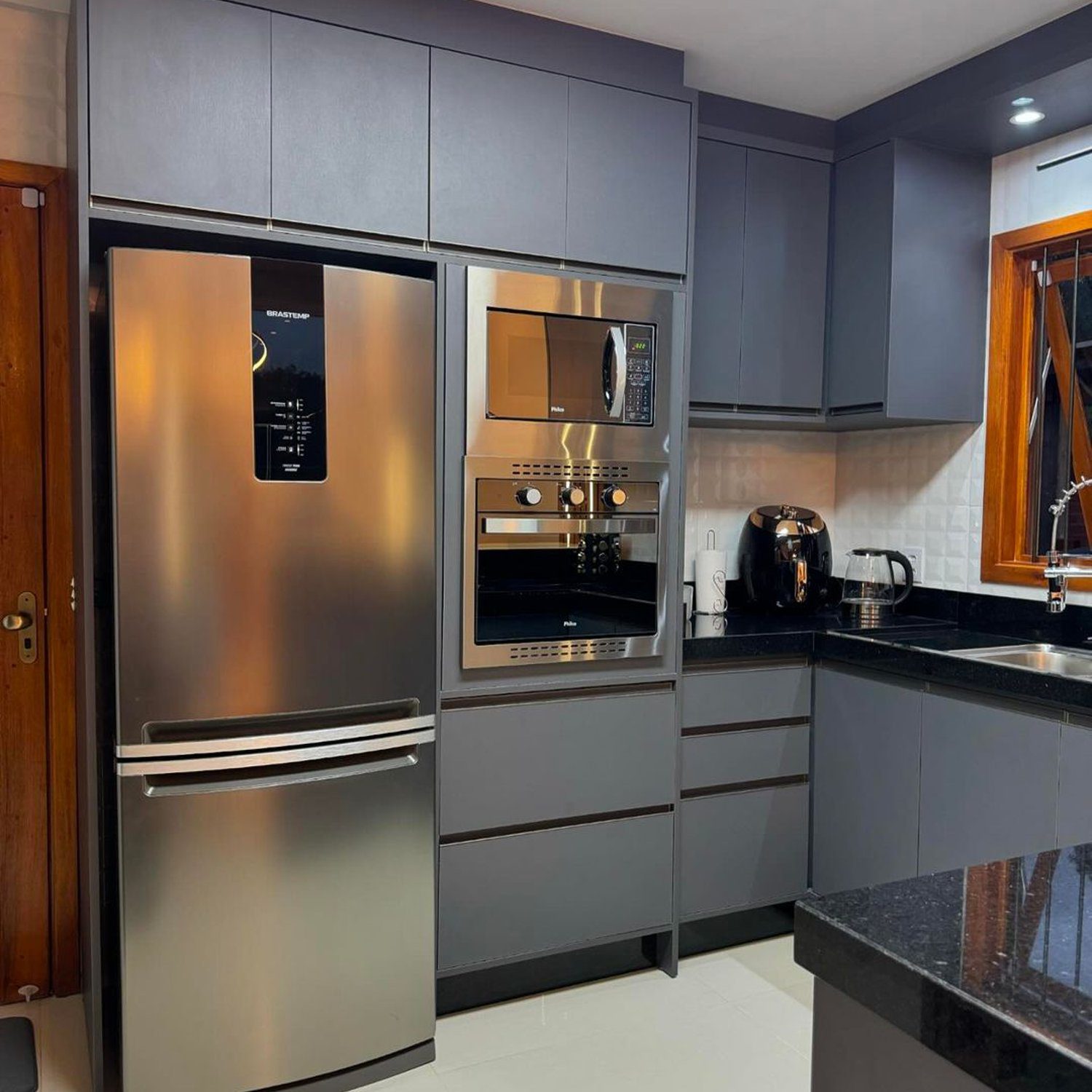 A sleek and modern kitchen featuring stainless steel appliances