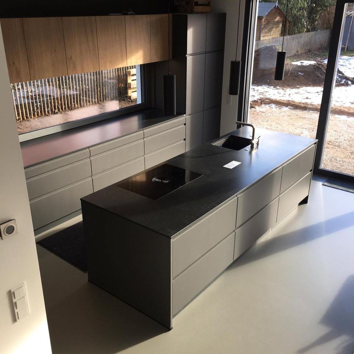 A sleek and modern kitchen with a central island