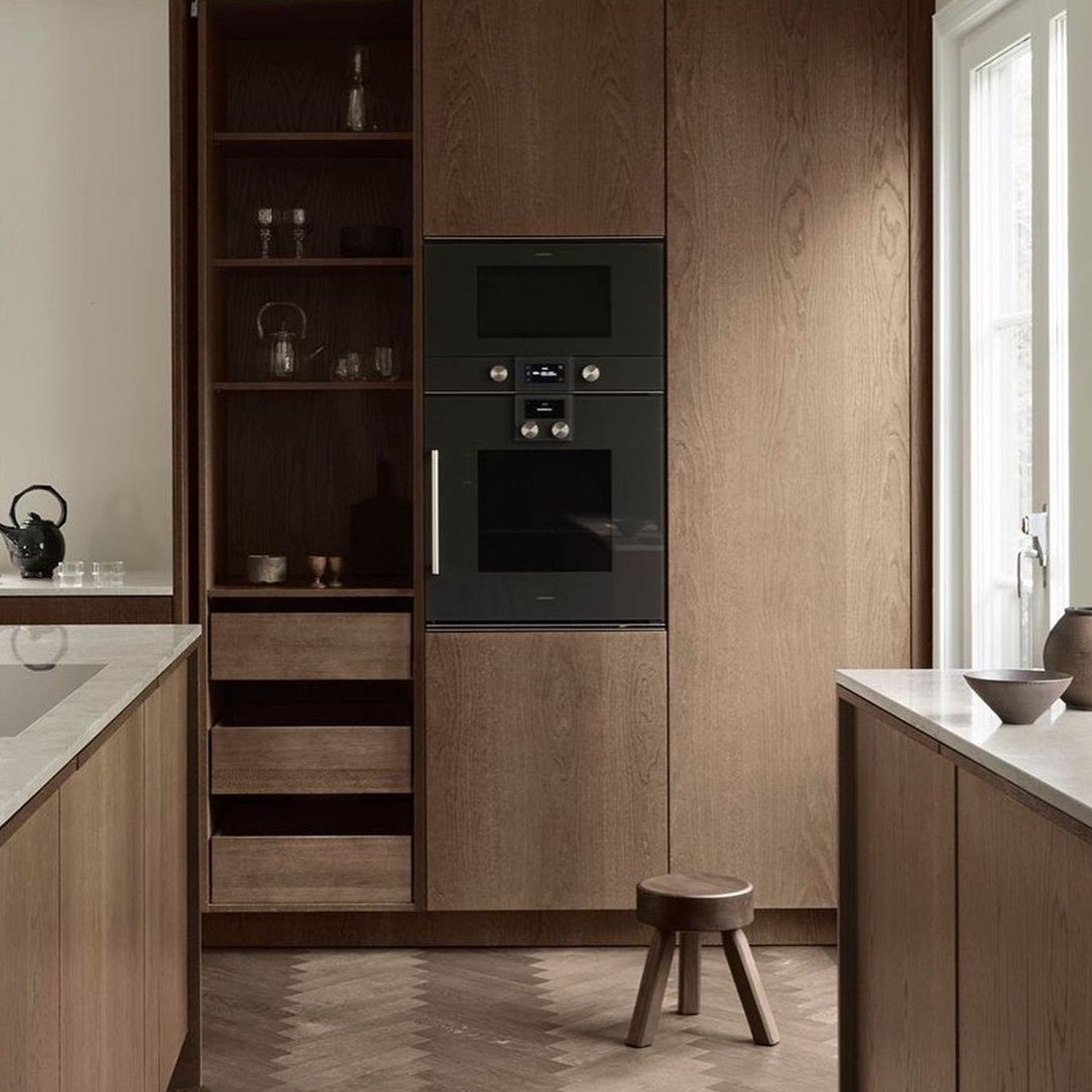 Elegant wooden kitchen cabinetry with built-in appliances