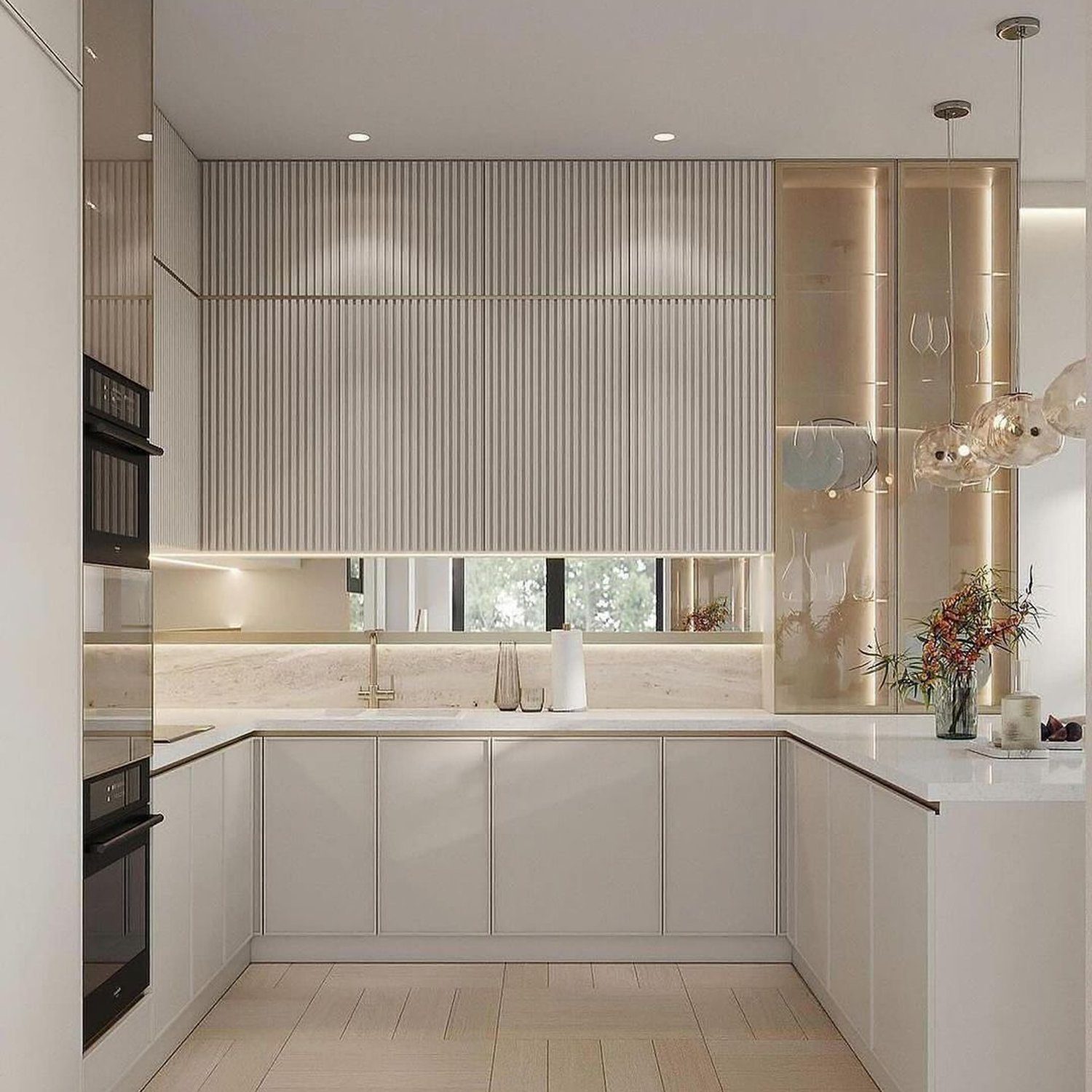 Elegant minimalist kitchen featuring a fluted texture backsplash, sleek cabinetry, and brass accents