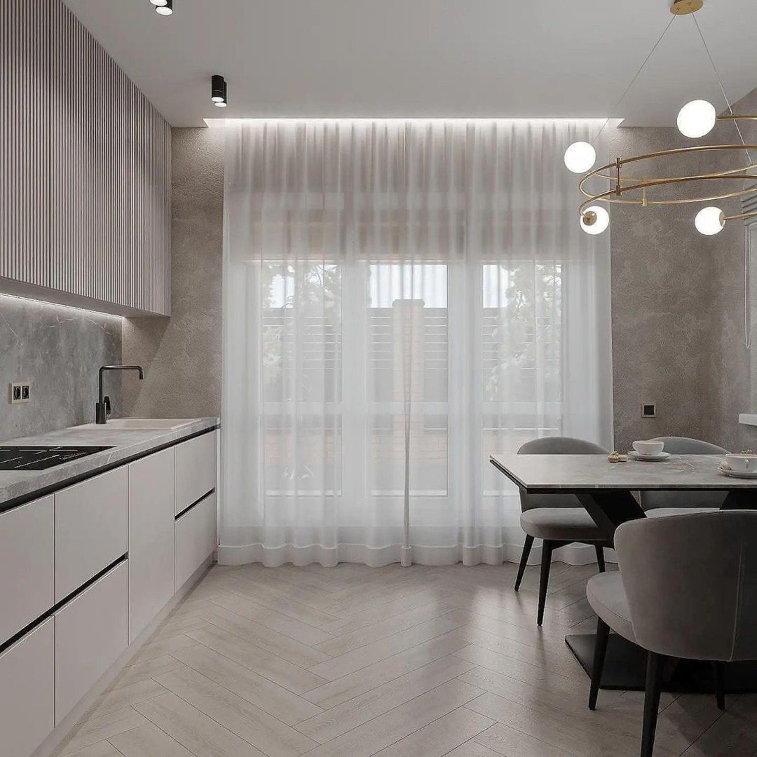 A stylish contemporary kitchen featuring a herringbone wooden floor, sleek white cabinetry, and a gray stone backsplash.