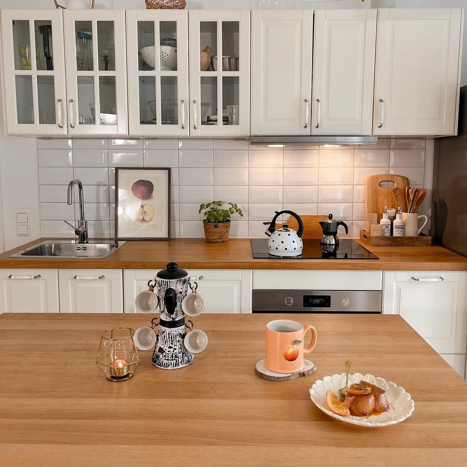 Cozy and well-lit kitchen space with modern appliances and wooden accents