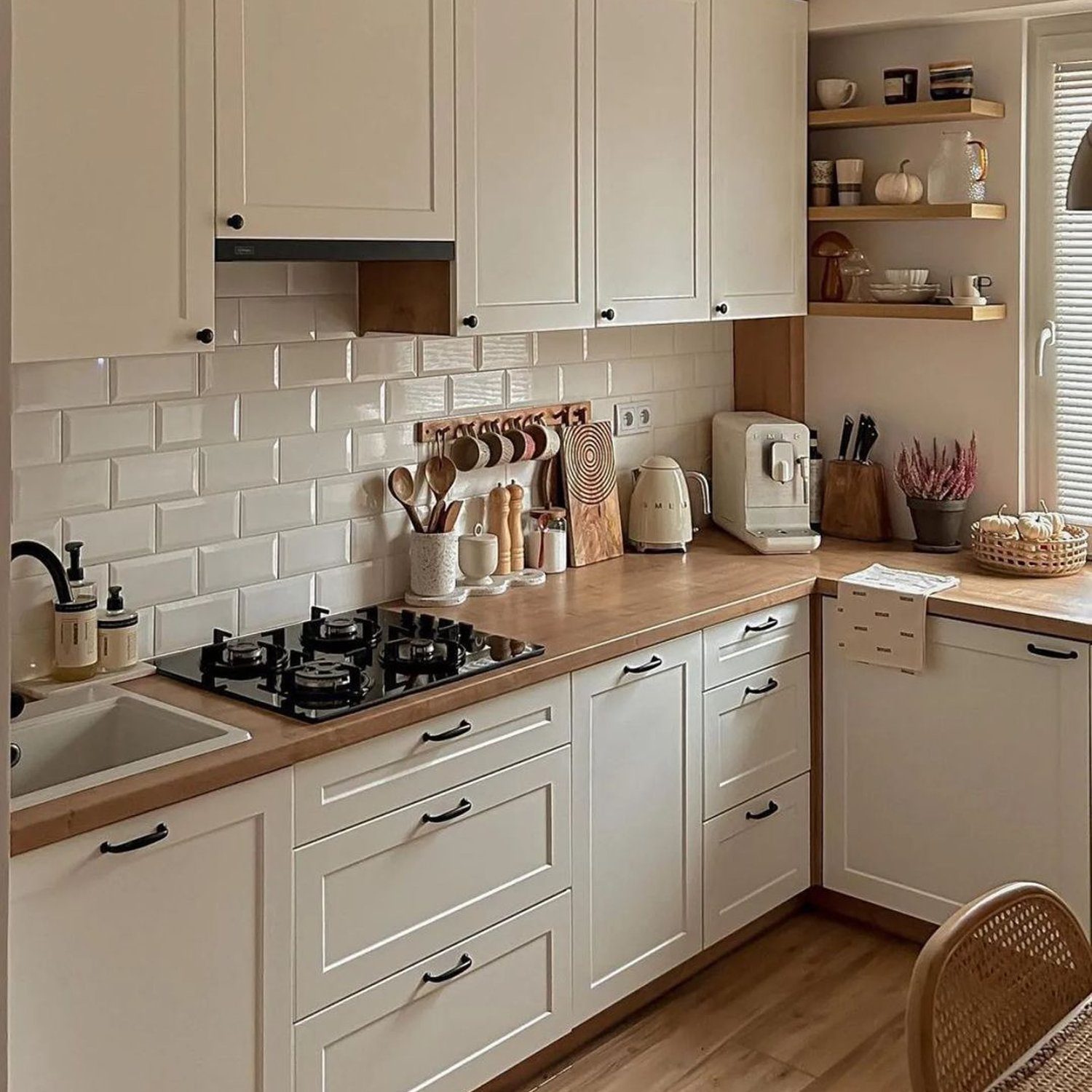 A modern kitchen with beige tone cabinets