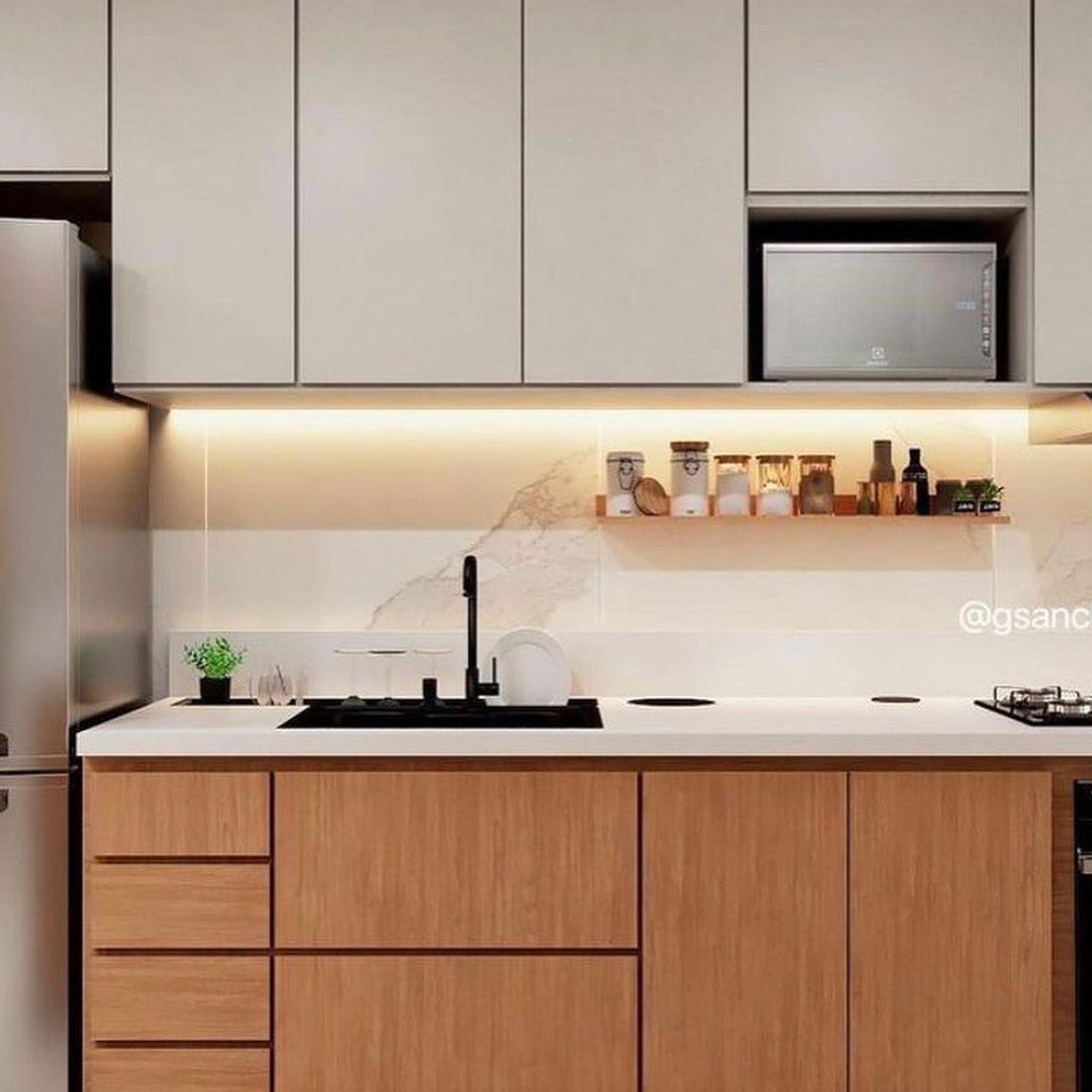 A sleek and modern kitchen design with wooden cabinetry and ambient lighting