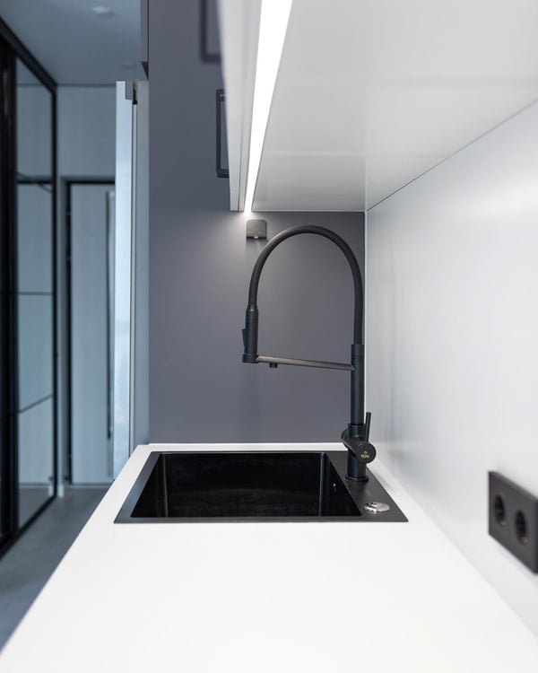 A modern kitchen sink with minimalist design