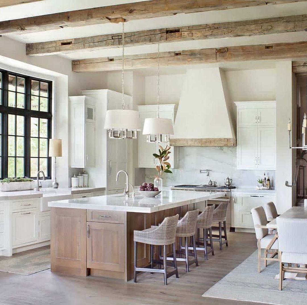 A chic and modern kitchen featuring exposed wooden beams and high contrast design elements.