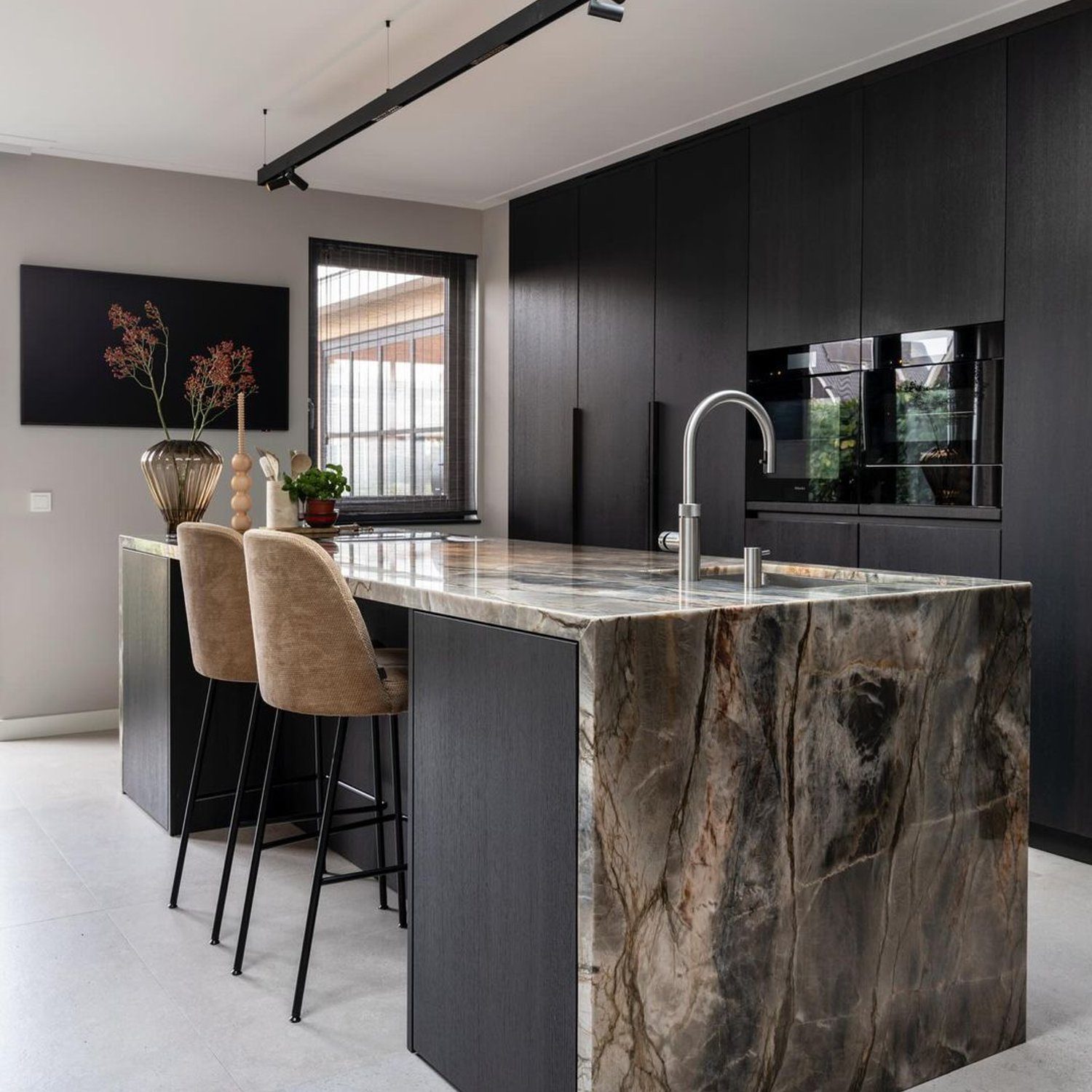 Elegant modern kitchen featuring a striking marble island