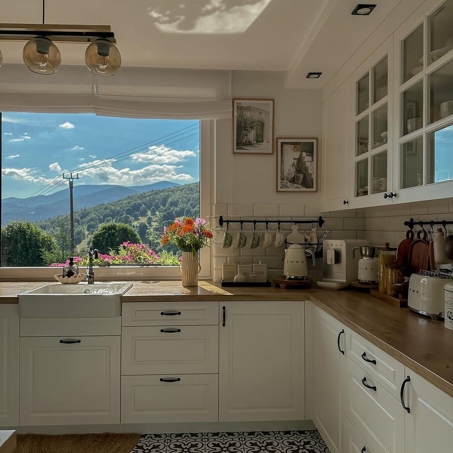 A modern kitchen with a breathtaking mountain view