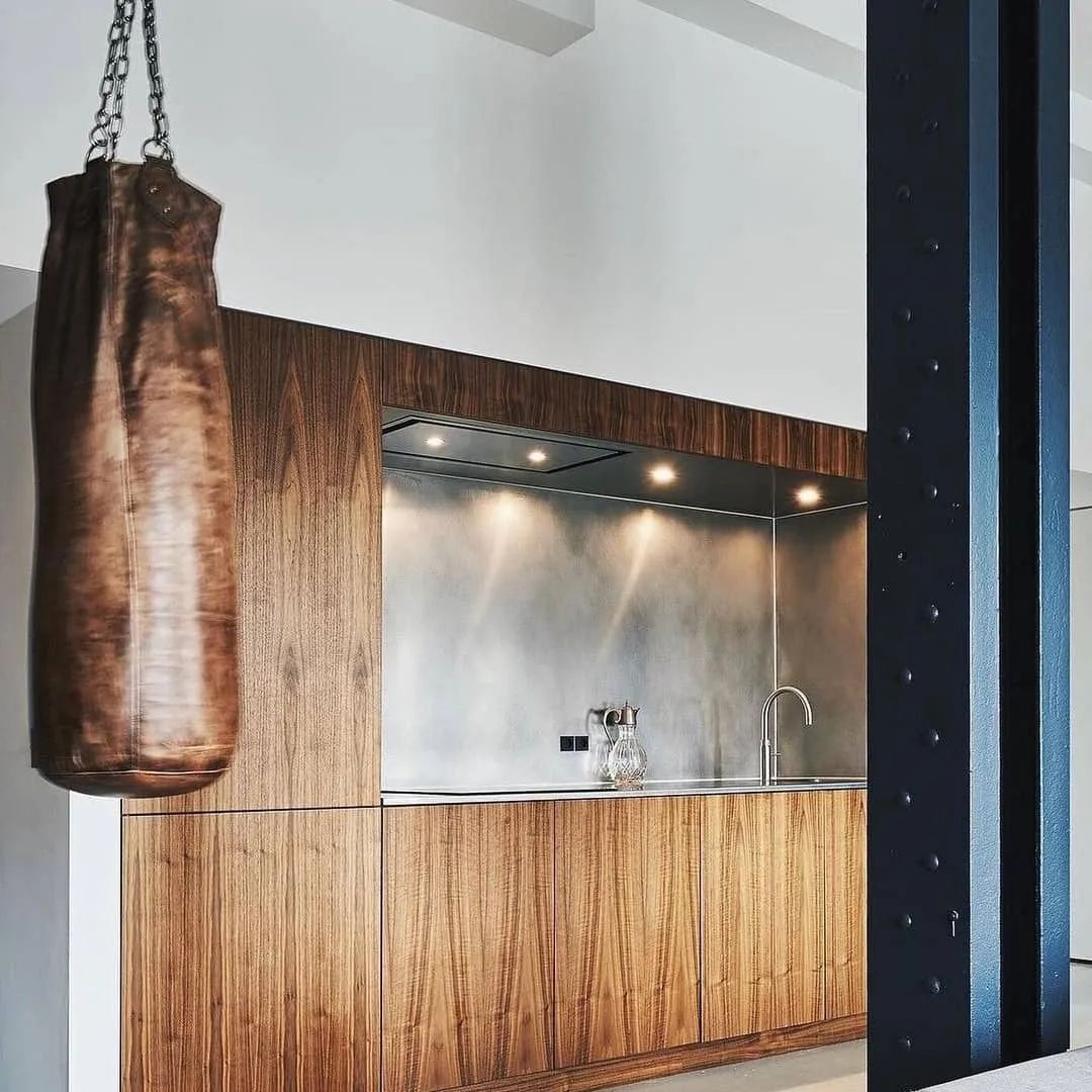 A chic modern kitchen featuring a walnut finish