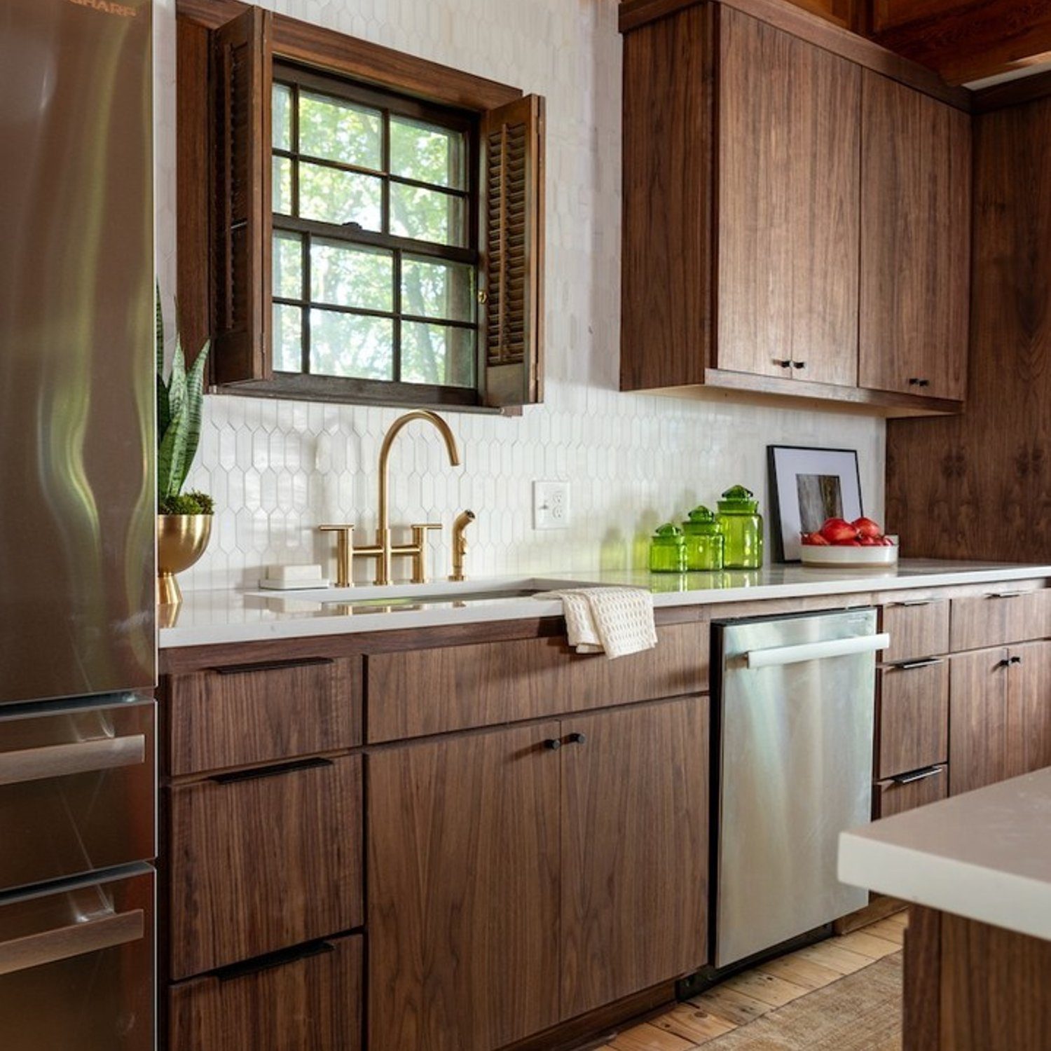 Stylish modern kitchen design with walnut cabinetry