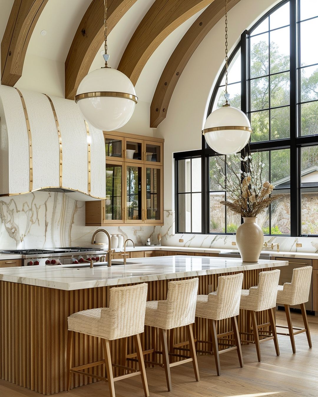 A modern kitchen with high ceilings, wooden beams, and large windows