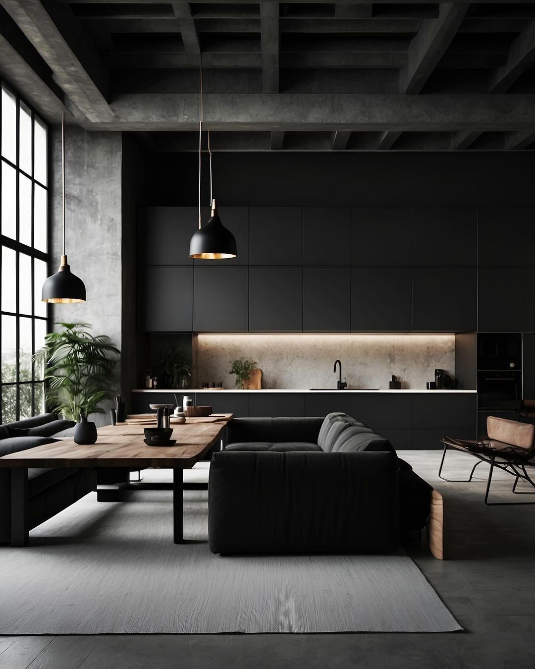 A sophisticated modern living room featuring a sleek black sofa and a long wooden dining table