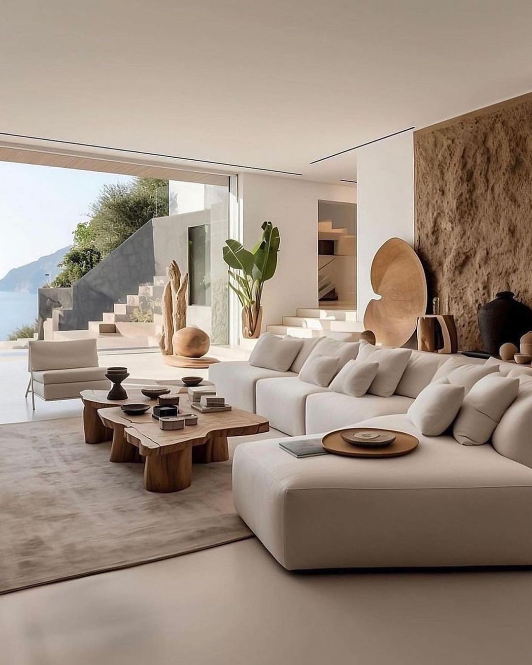 A modern and serene living room overlooking a majestic view