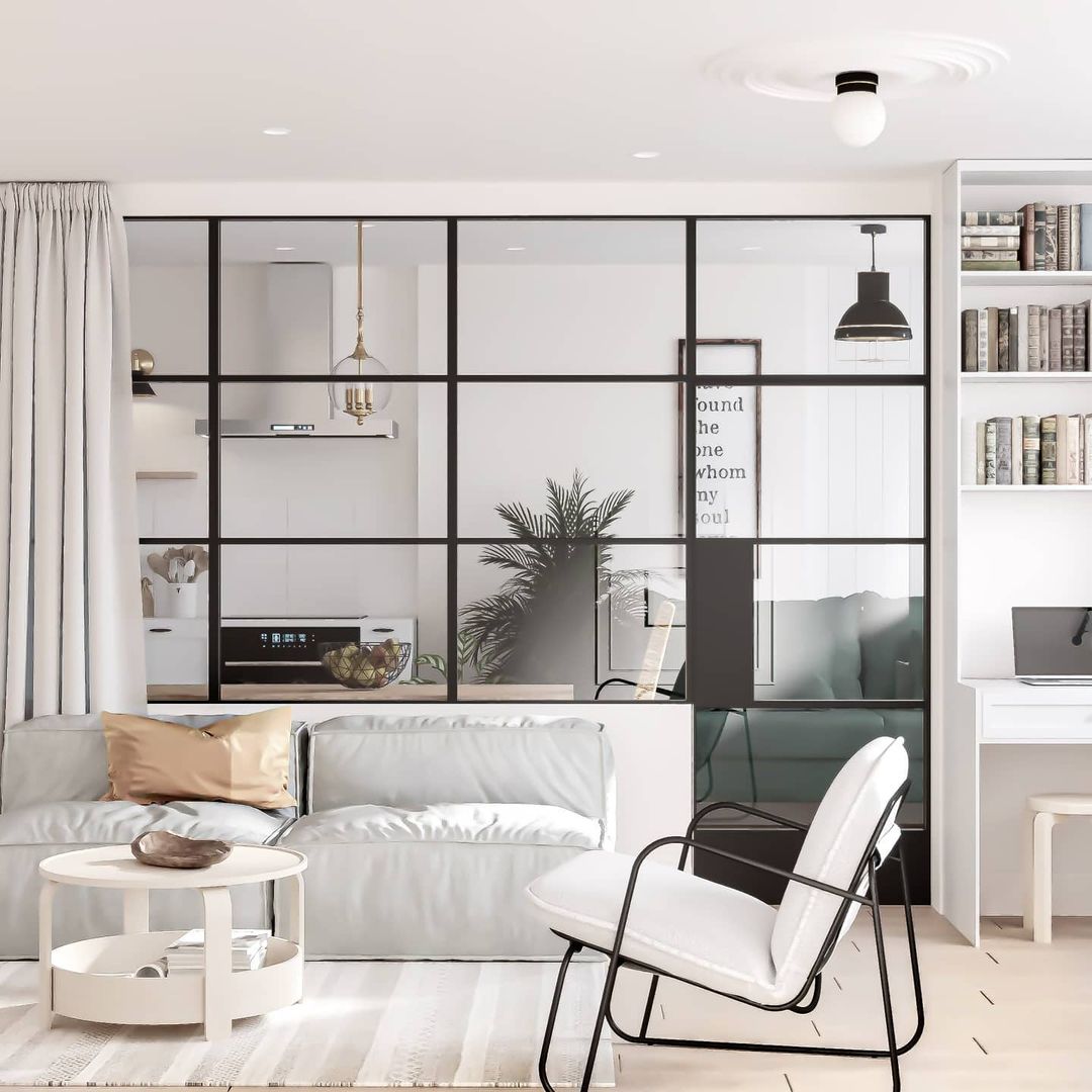 A modern and sleek living room with black-framed glass partition