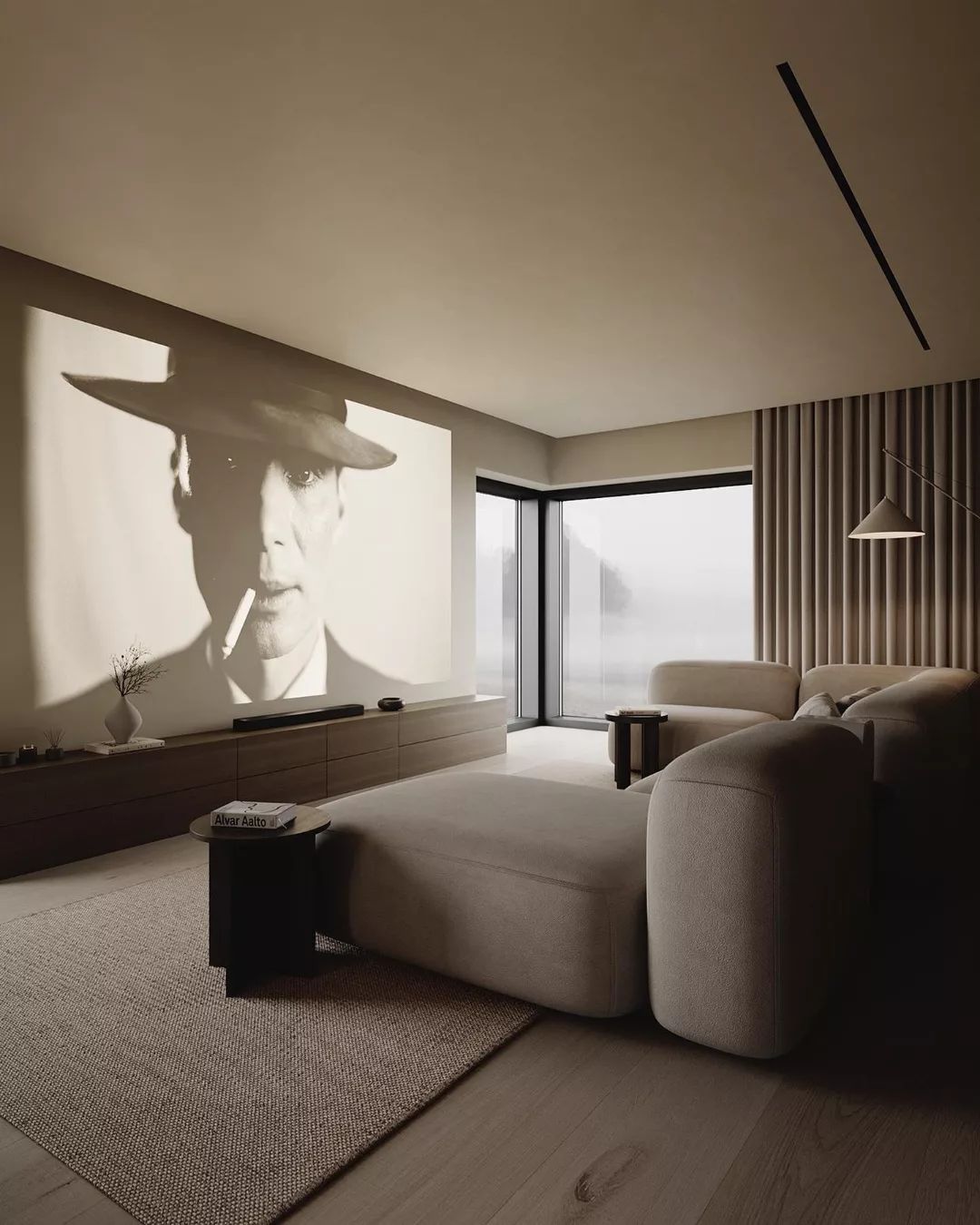 A modern minimalist living room featuring a large monochromatic portrait on the wall