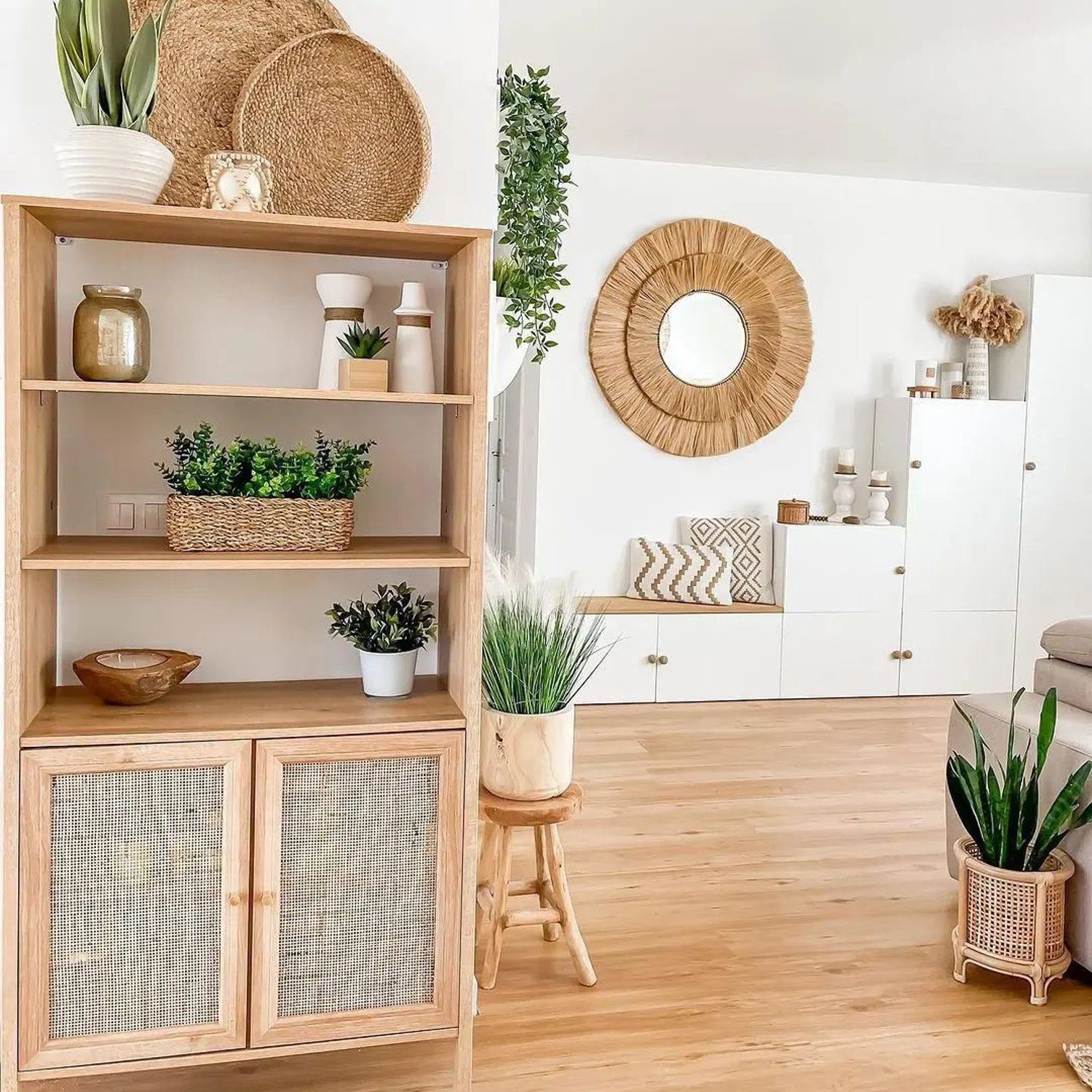 A serene and modern living room featuring natural wood accents and greenery