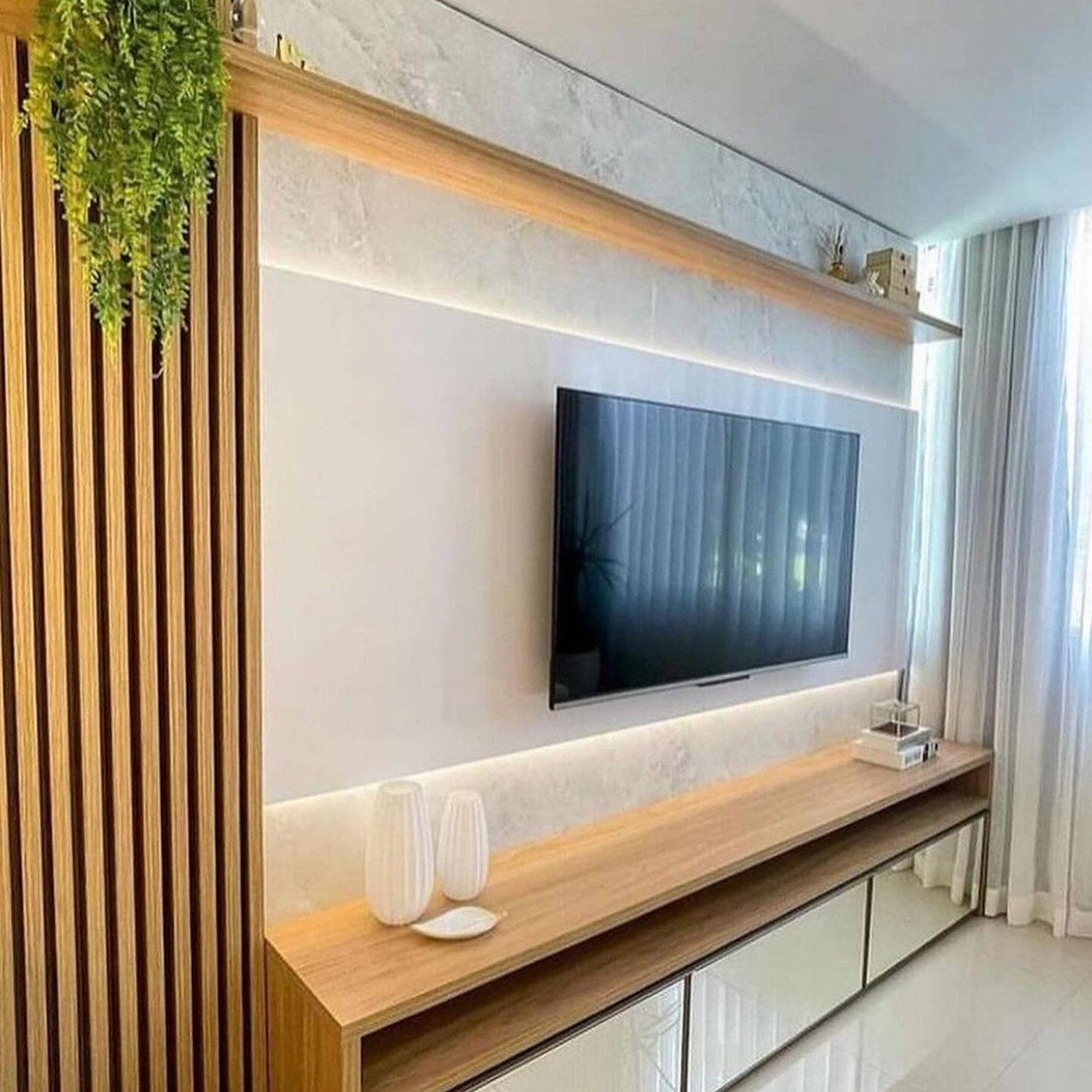 A sleek and modern living room centerpiece featuring a wall-mounted TV