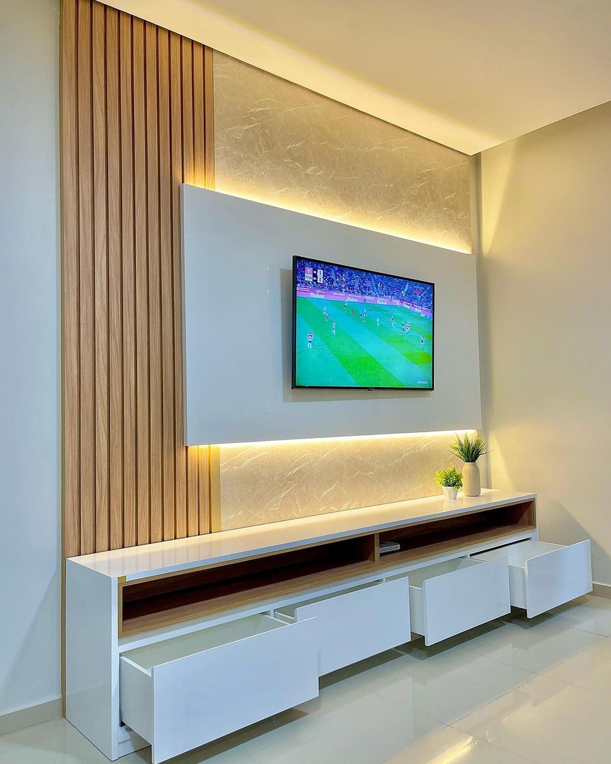 An elegantly modern living room with wall-mounted TV