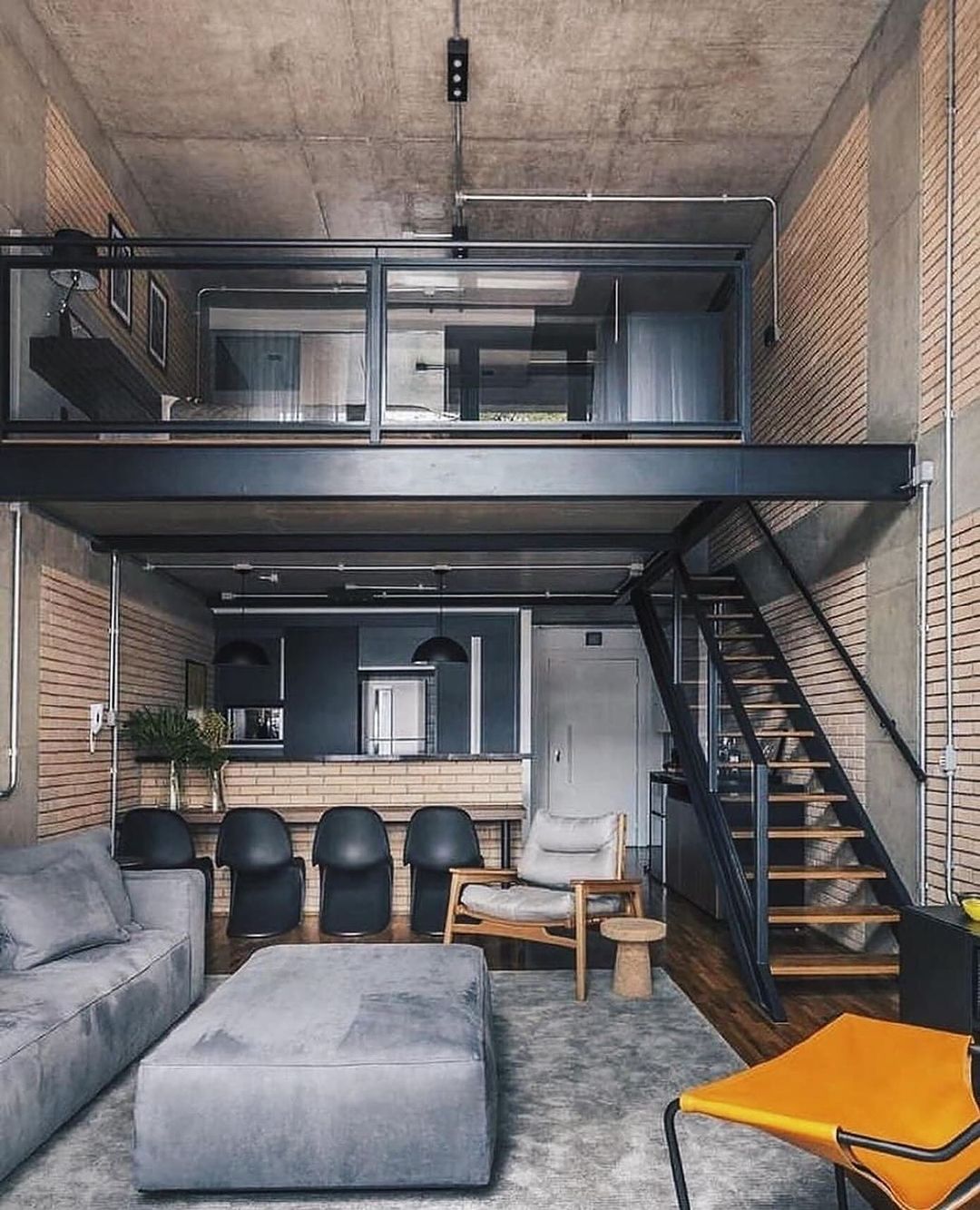 A modern loft-style apartment with industrial design elements