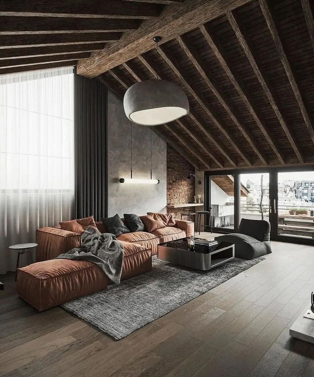 A modern loft-style living room with exposed wooden beams