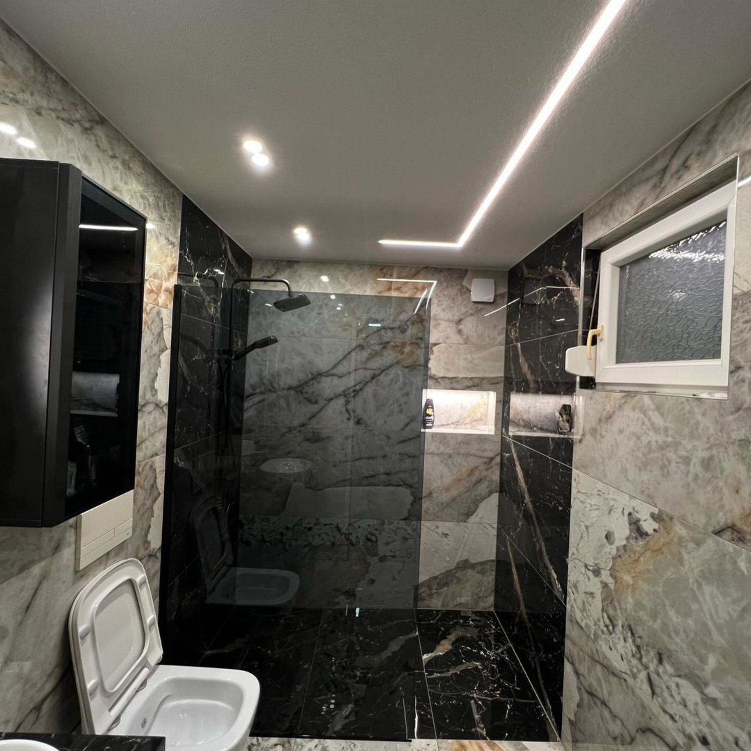 Luxurious modern bathroom with marble tiles