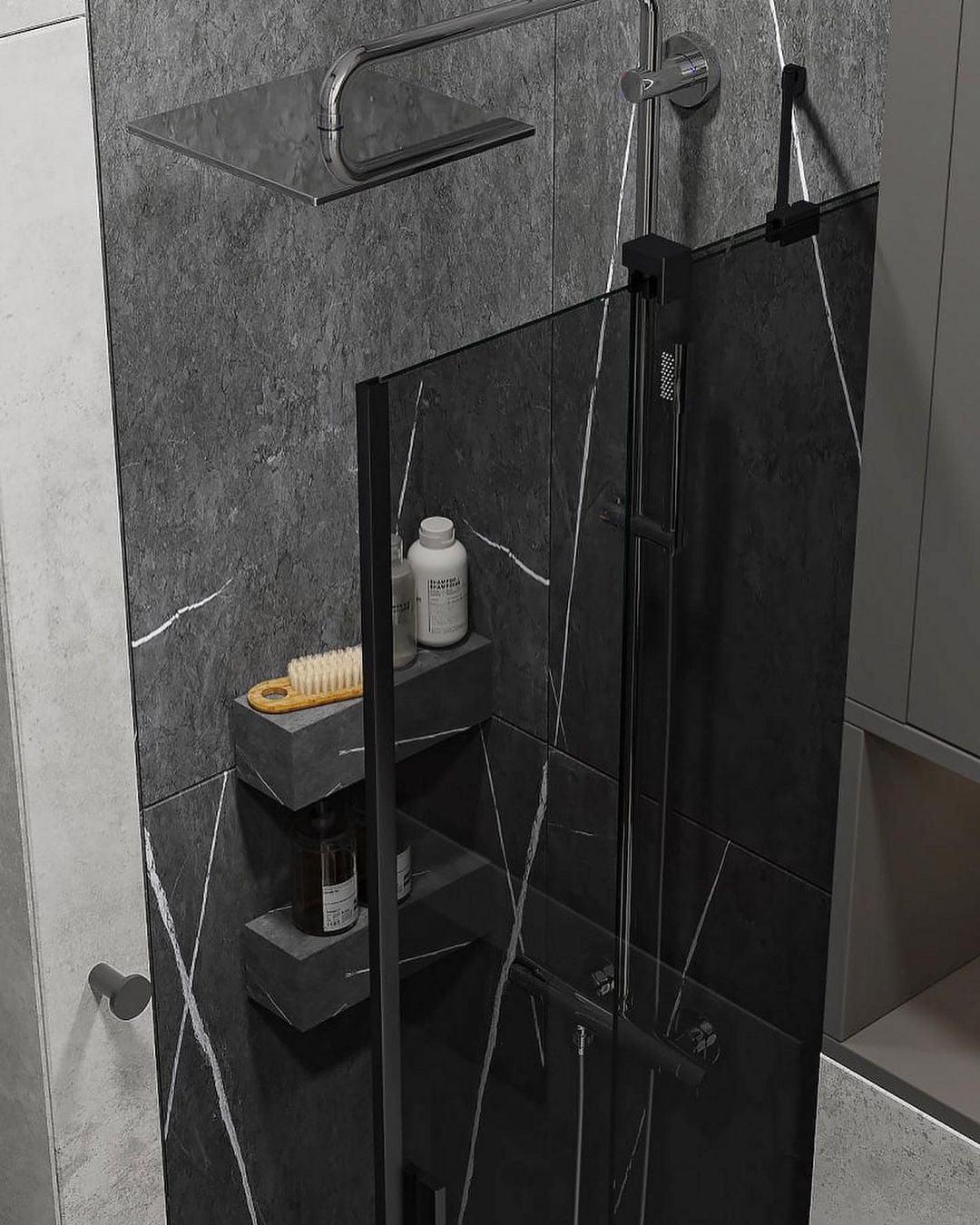 A modern bathroom featuring dark marble tiles with a sleek black glass shower enclosure