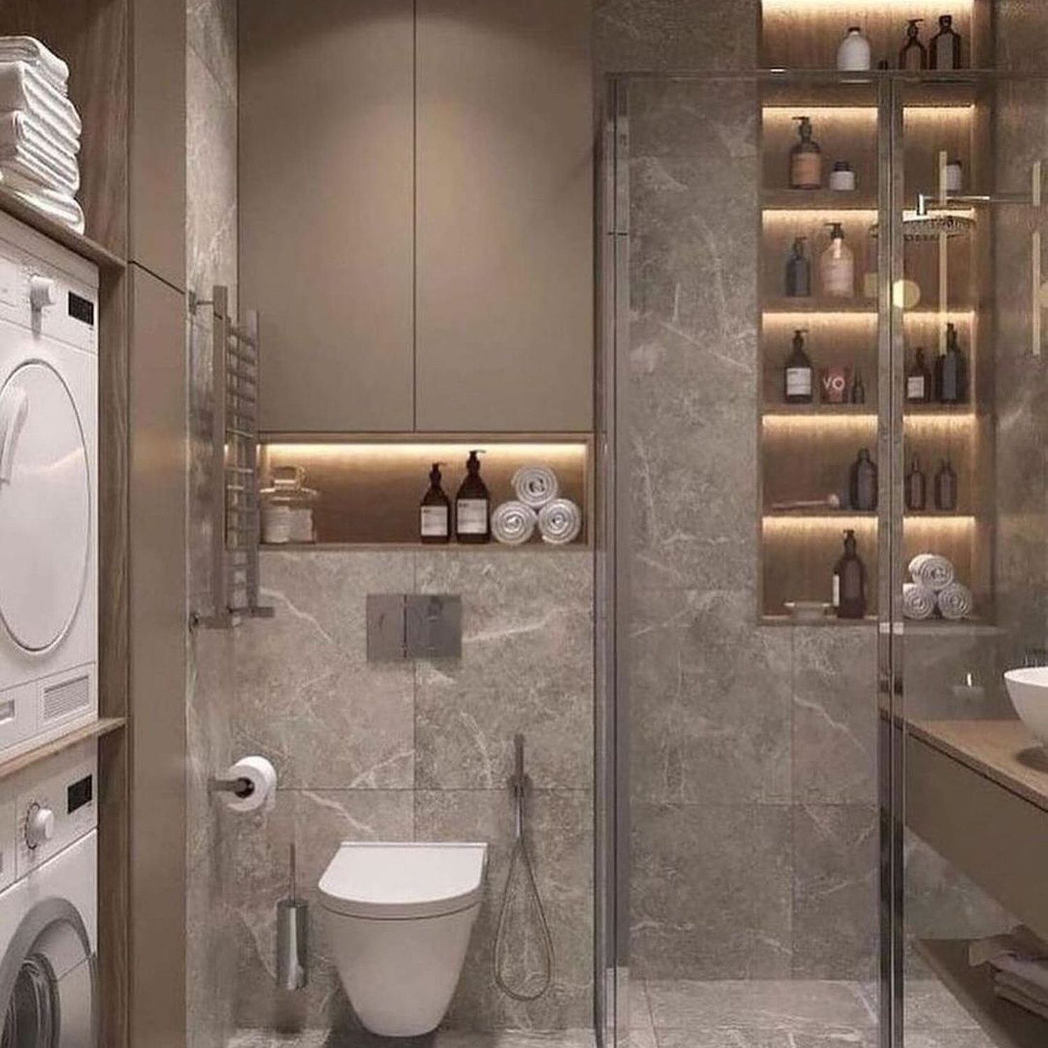 A modern bathroom design featuring a combination of grey marble tiles, integrated laundry facilities, and sleek fixtures